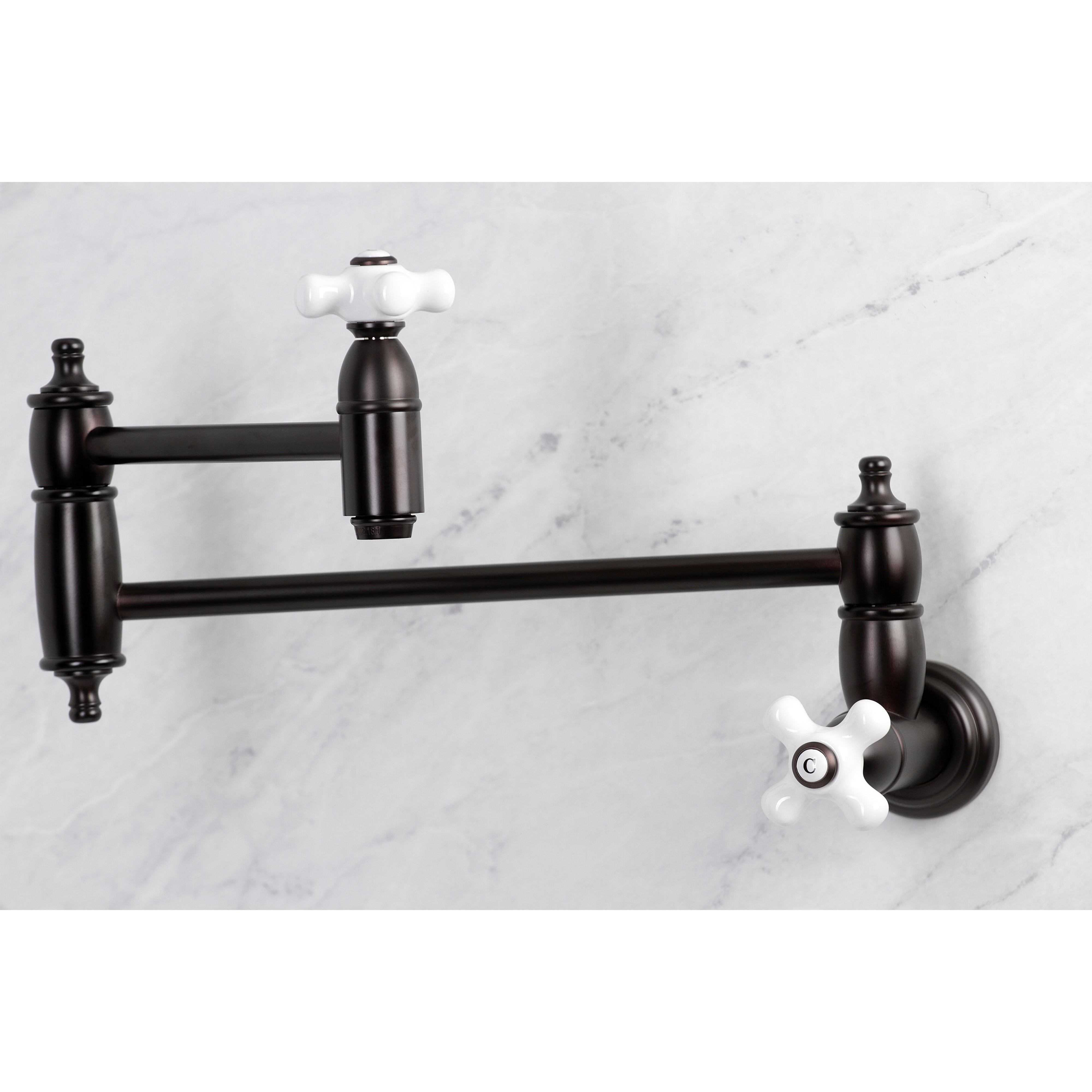 Kingston Brass KS310PXAC Restoration Wall Mount Pot Filler Faucet, Antique Copper with white handles and extendable arm.