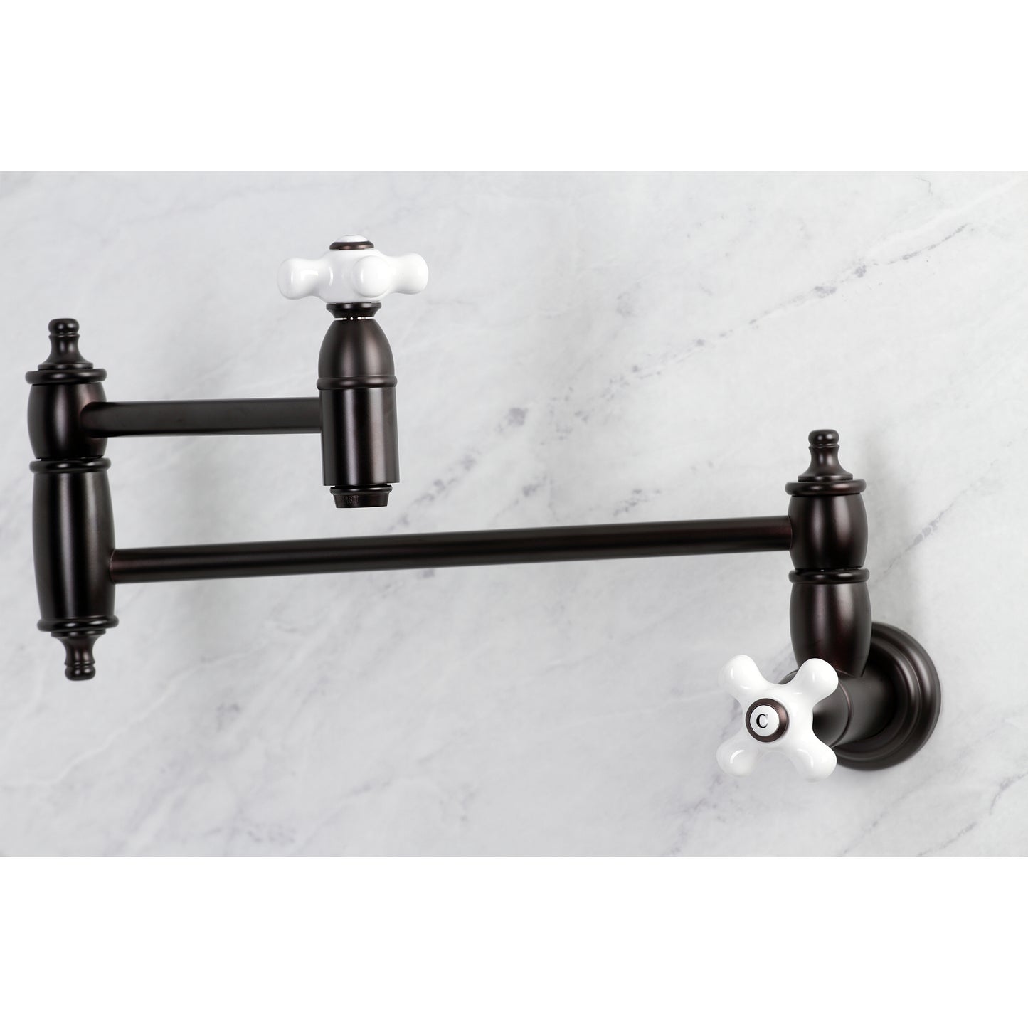 Kingston Brass KS310PXAC Restoration Wall Mount Pot Filler Faucet, Antique Copper with white handles and extendable arm.