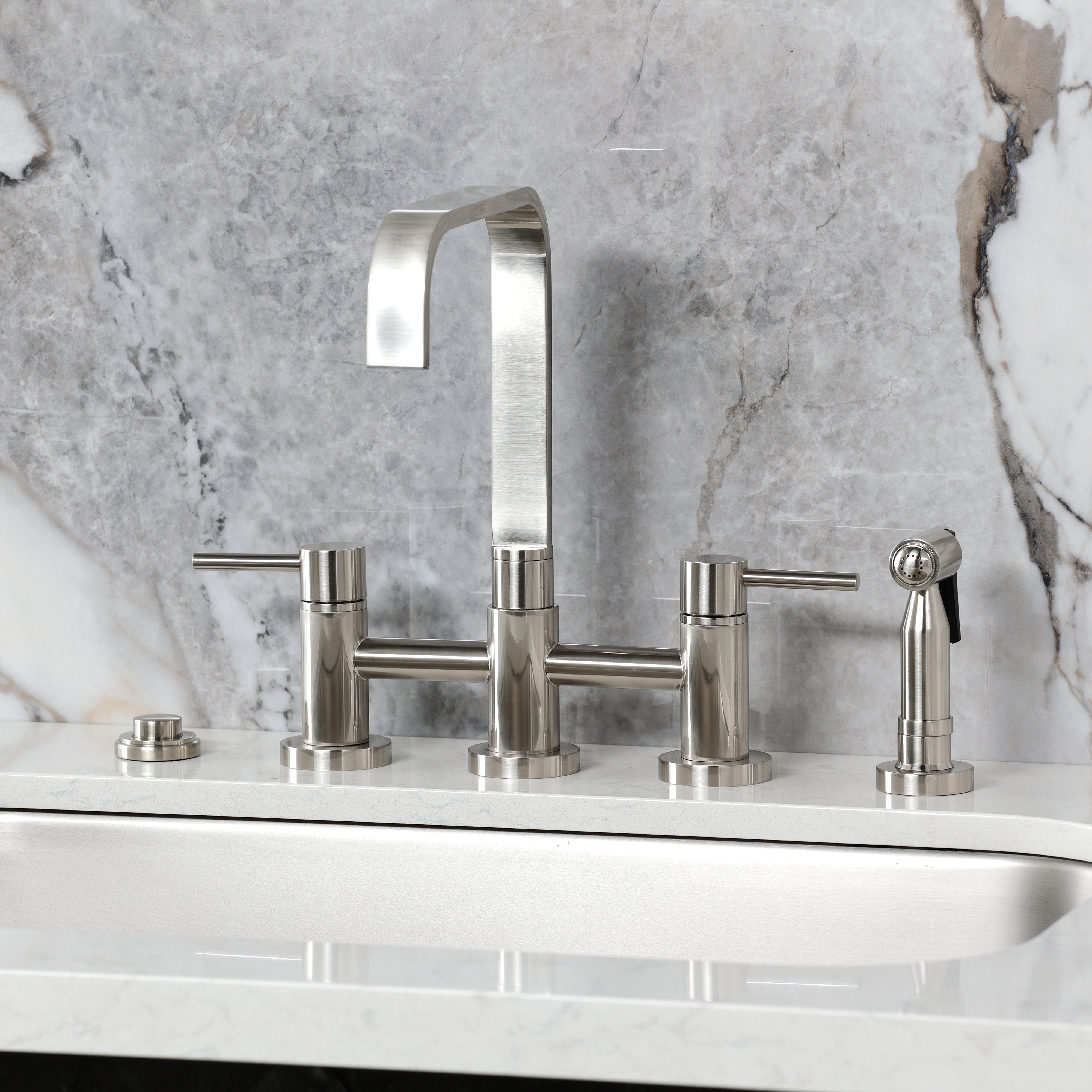 Kingston KS8257DLBS Concord Bridge Kitchen Faucet with Brass Sprayer, Brushed Brass on marble surface