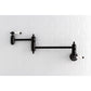 Kingston Brass KS3103PL Restoration Wall Mount Pot Filler Faucet, Antique Brass with a sleek black finish.