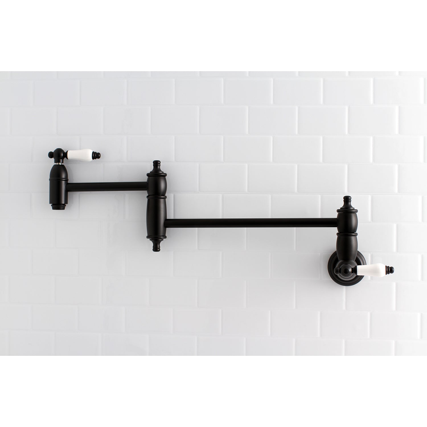Kingston Brass KS3103PL Restoration Wall Mount Pot Filler Faucet, Antique Brass with a sleek black finish.