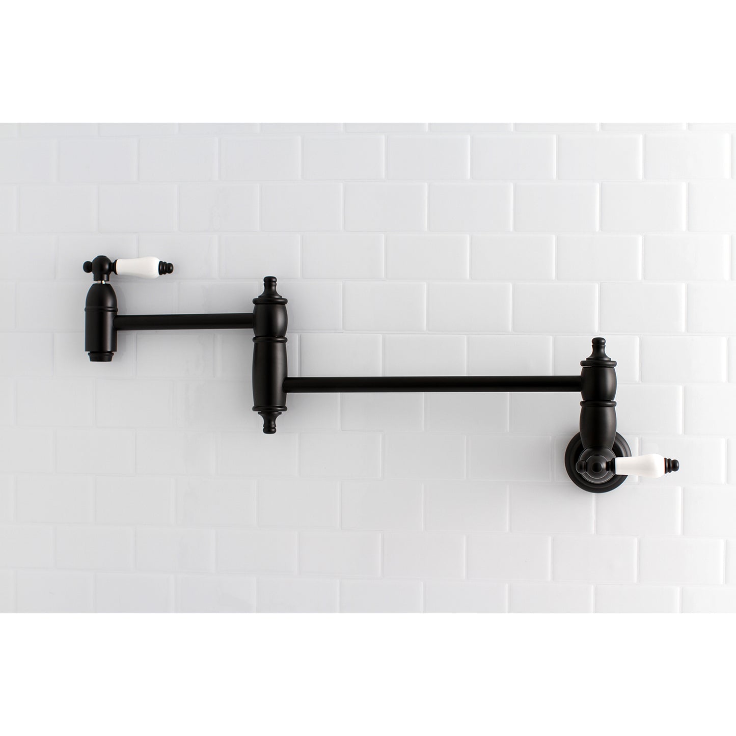 Kingston Brass KS3103PL Restoration Wall Mount Pot Filler Faucet, Antique Brass with a sleek black finish.