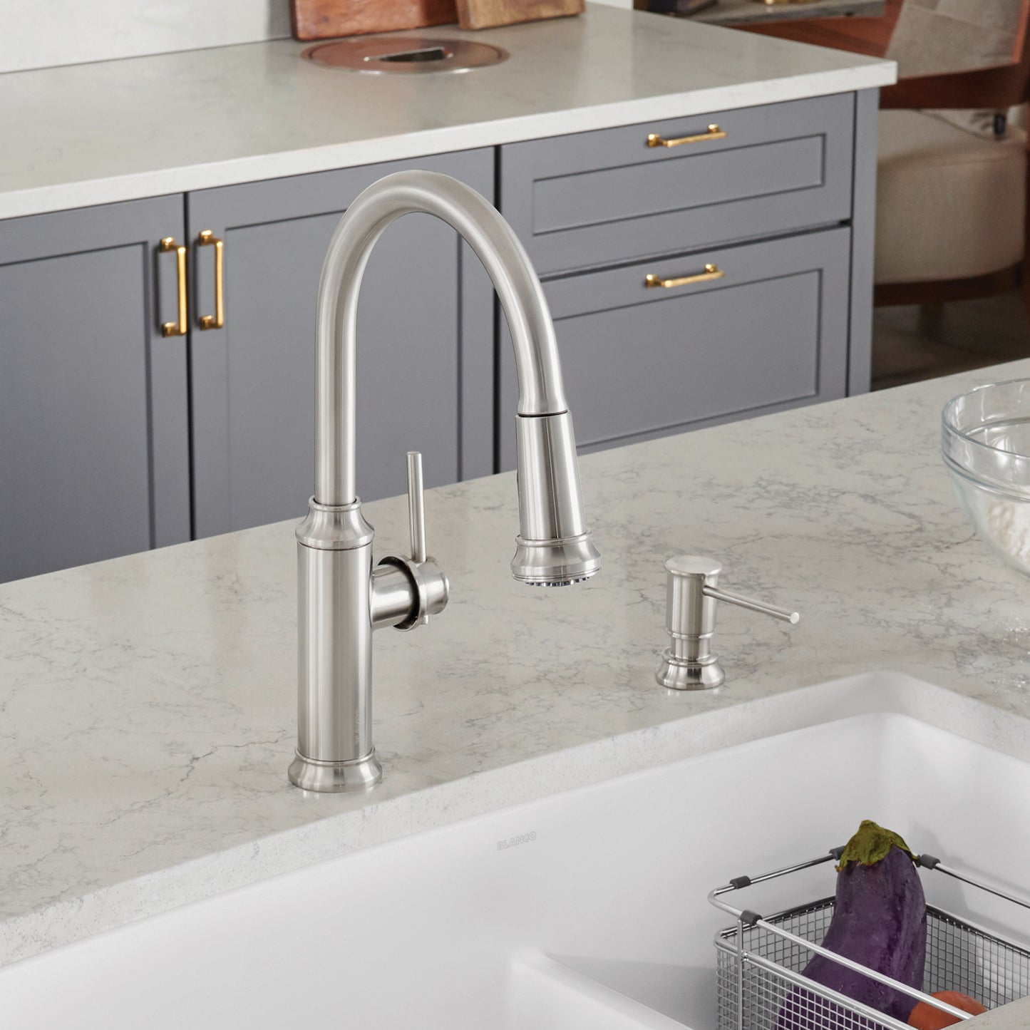 BLANCO Empressa High Arc Pull-Down Dual-Spray Kitchen Faucet in a modern kitchen setup with grey cabinetry.