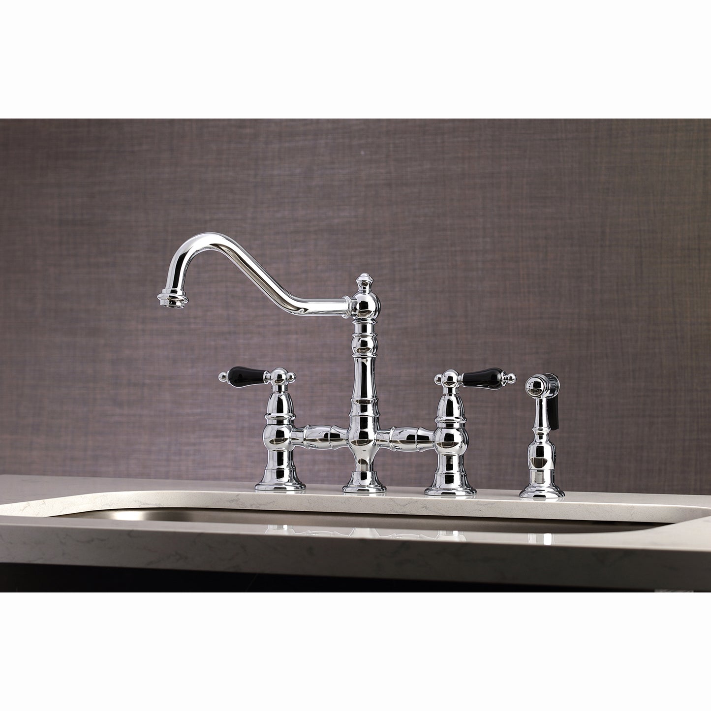 Kingston KS3277PKLBS Duchess Bridge Kitchen Faucet with Brass Sprayer, Brushed Brass in a kitchen setting.
