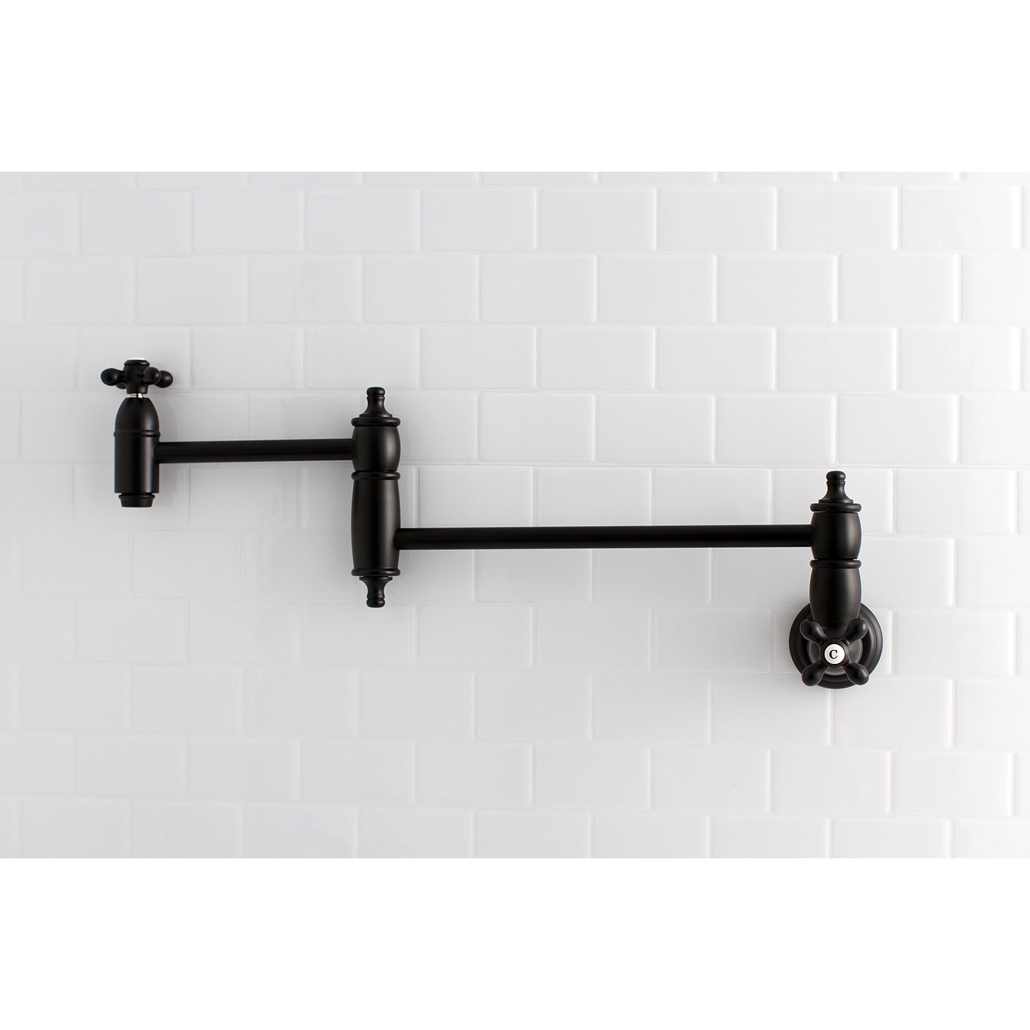 Kingston Brass KS3103AX Restoration Wall Mount Pot Filler Faucet, Antique Brass with a stylish black finish.