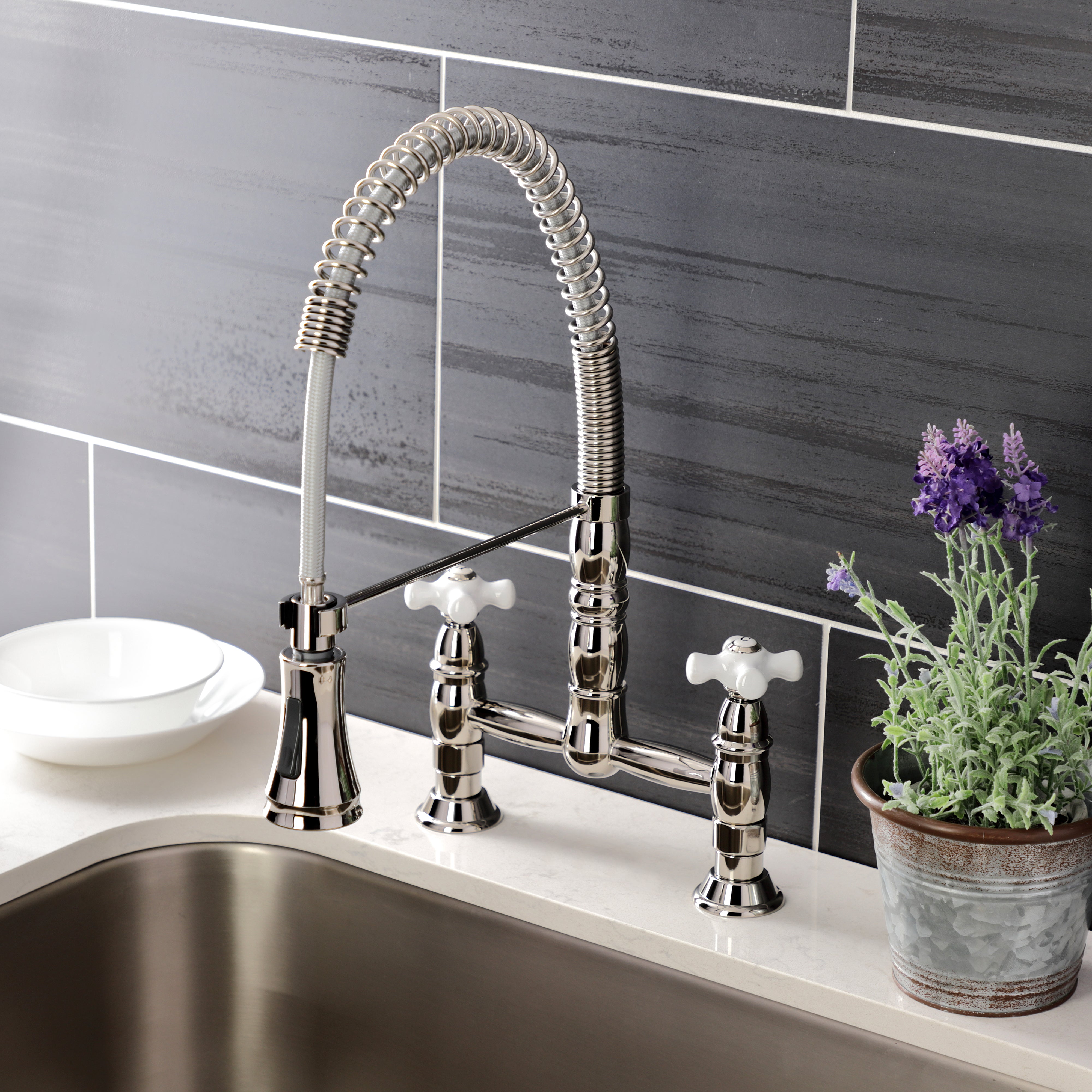 Gourmetier GS1273PX Heritage Double-Handle Deck-Mount Pre-Rinse Bridge Kitchen Faucet, Antique Brass in a modern kitchen setting.