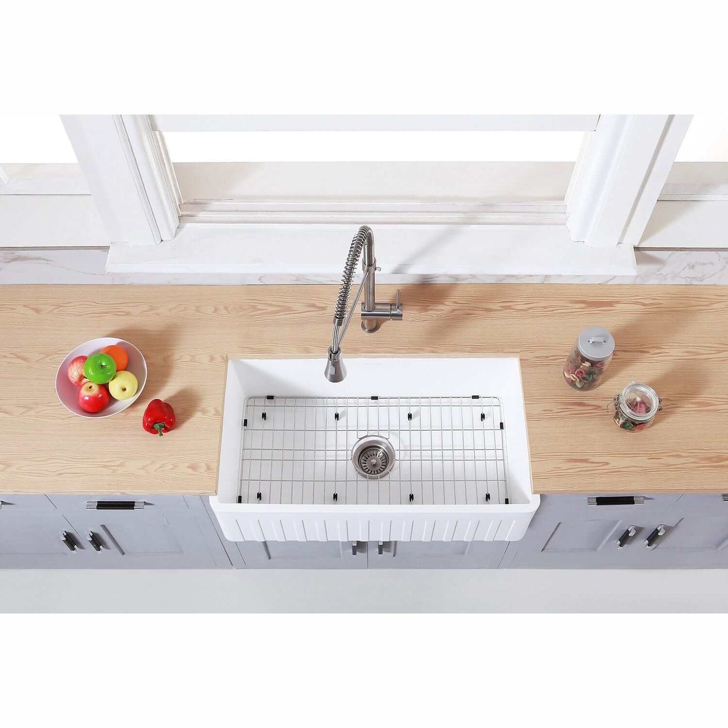 Top view of Kingston Brass 36" Apron Front Single Bowl Farmhouse Kitchen Sink - Solid Surface White Stone with kitchen fixtures.