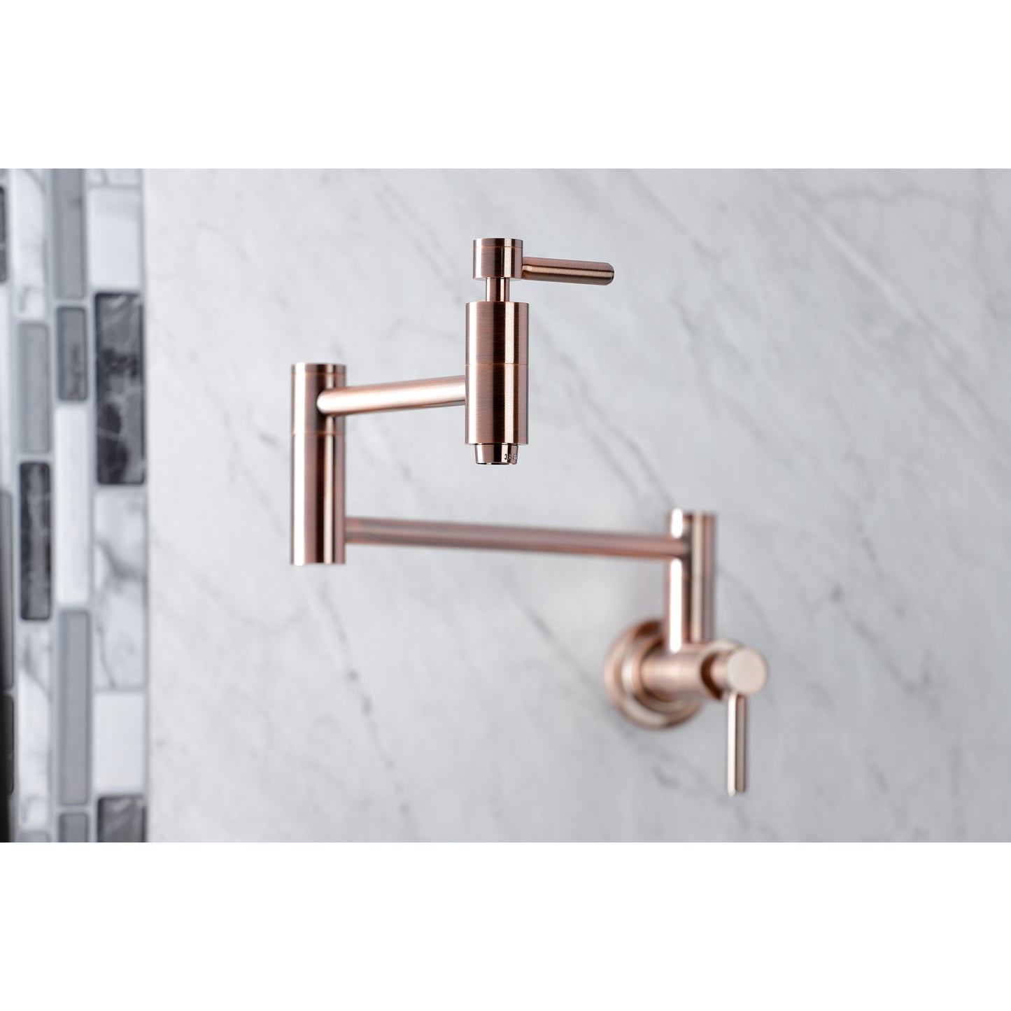 Kingston Brass KS8103DL Concord Wall Mount Pot Filler Faucet, Antique Brass on a marble background.