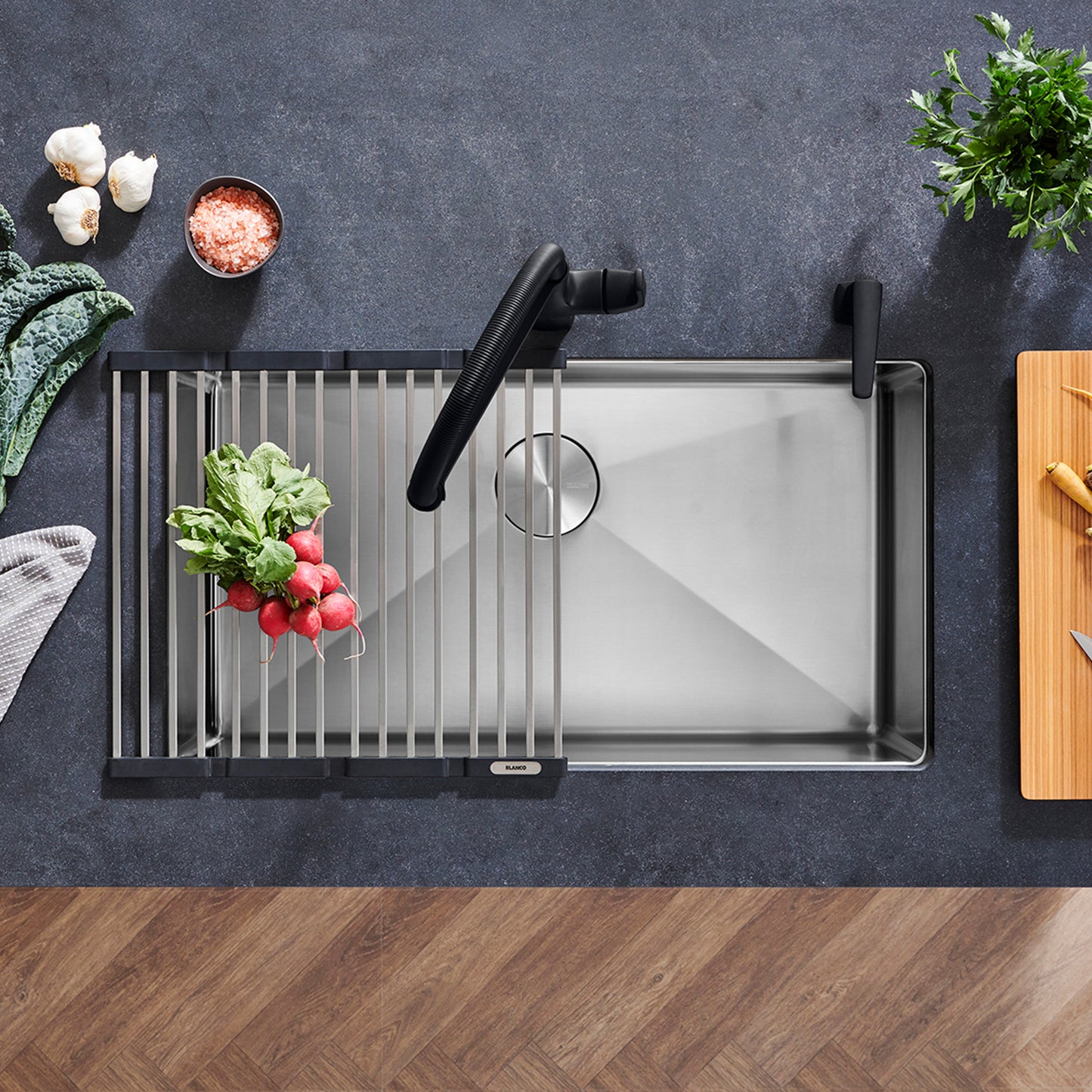 BLANCO Quatrus R15 32" Super Single Bowl Undermount Stainless Steel Kitchen Sink with vegetables and accessories.