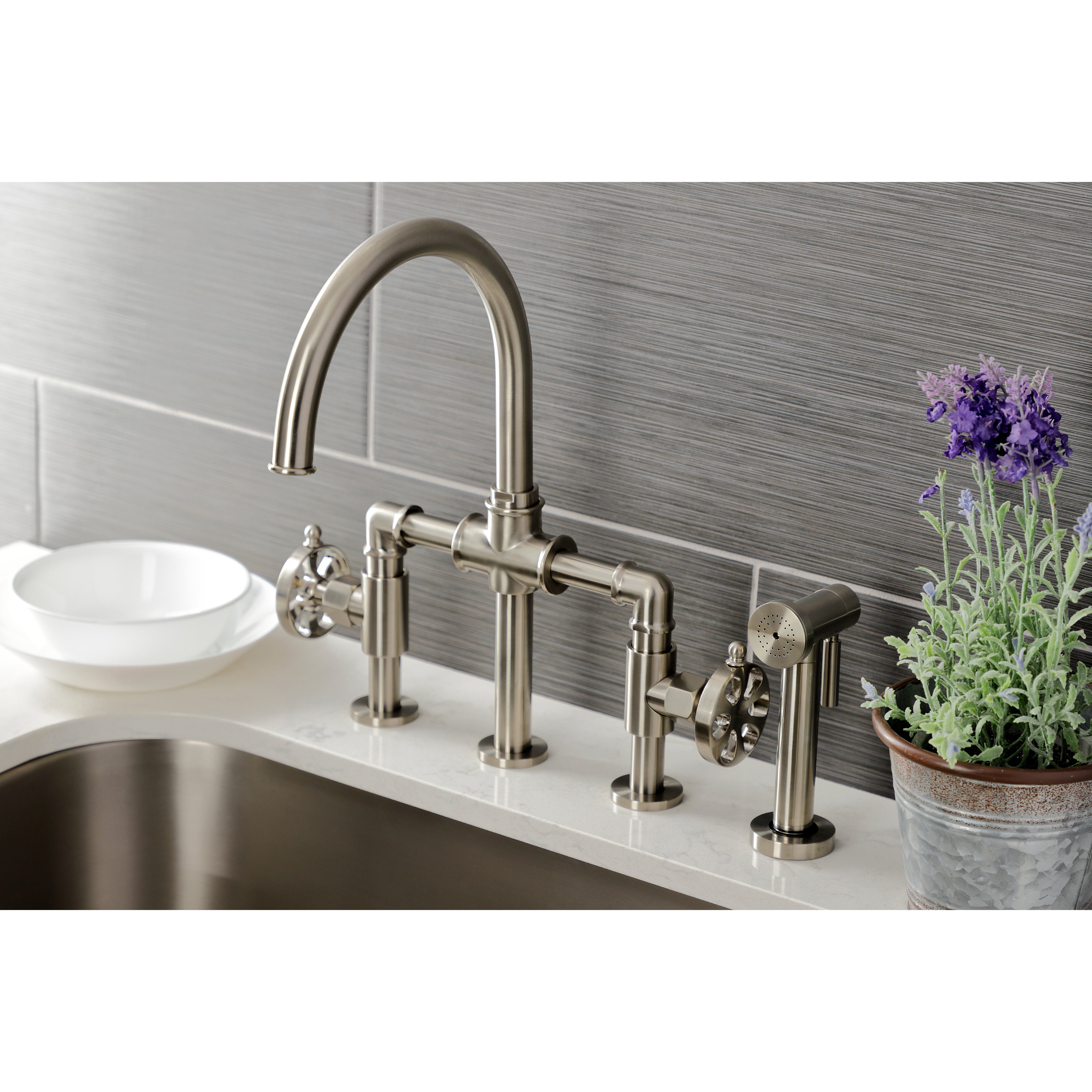 Kingston KS2333RX Belknap Industrial Style Bridge Kitchen Faucet with Brass Sprayer, Antique Brass in kitchen setting.