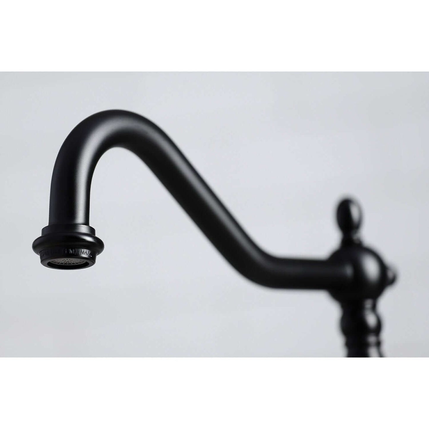 Close-up view of the spout of the KINGSTON Brass Widespread Kitchen Faucet with Brass Sprayer - KB1790ALBS.