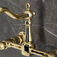 Kingston KS1263PX Heritage Two-Handle Wall Mount Bridge Kitchen Faucet, Antique Brass close-up view of handle