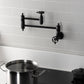 Kingston Brass KS3103RKZ Wendell Wall Mount Pot Filler Faucet with Knurled Handle, Antique Brass in modern kitchen setting.