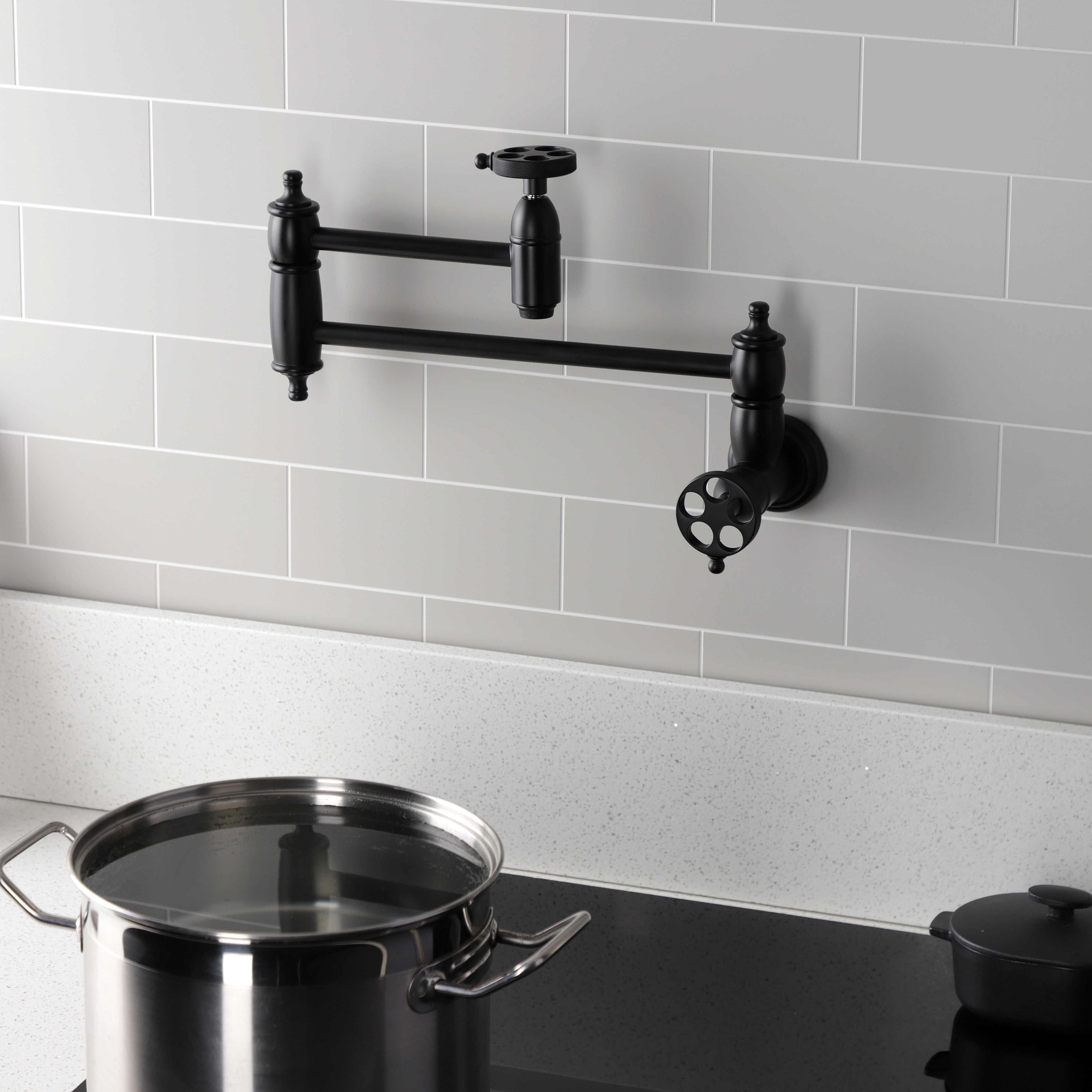 Kingston Brass KS3103RKZ Wendell Wall Mount Pot Filler Faucet with Knurled Handle, Antique Brass in modern kitchen setting.