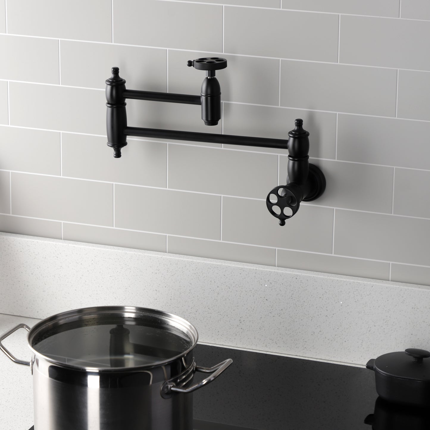 Kingston Brass KS3103RKZ Wendell Wall Mount Pot Filler Faucet with Knurled Handle, Antique Brass in modern kitchen setting.