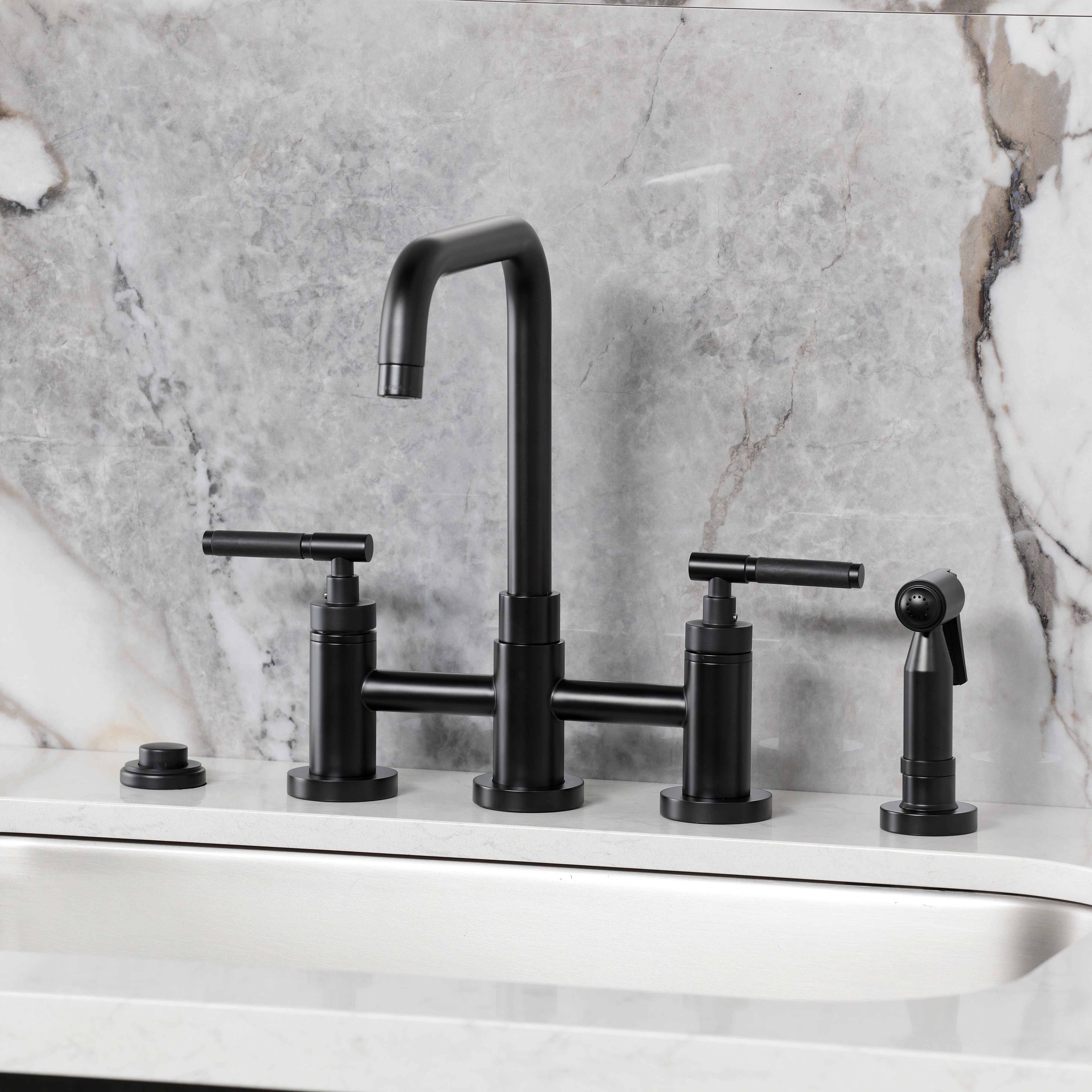 Kingston KS8287CKLBS Kaiser Bridge Kitchen Faucet with Brass Sprayer, Brushed Brass on a modern countertop.