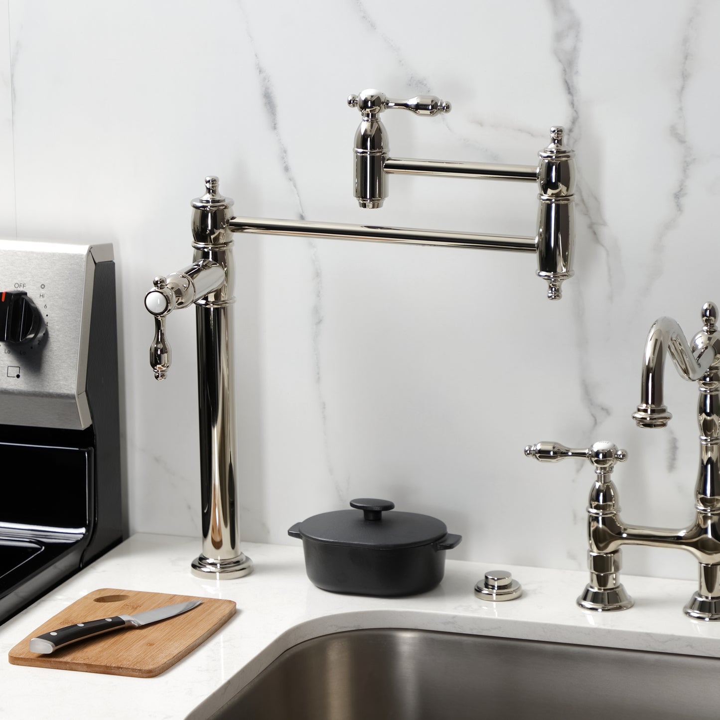 Kingston Brass KS3708TAL Tudor Deck Mount Pot Filler Faucet, Brushed Nickel on a countertop with stove.
