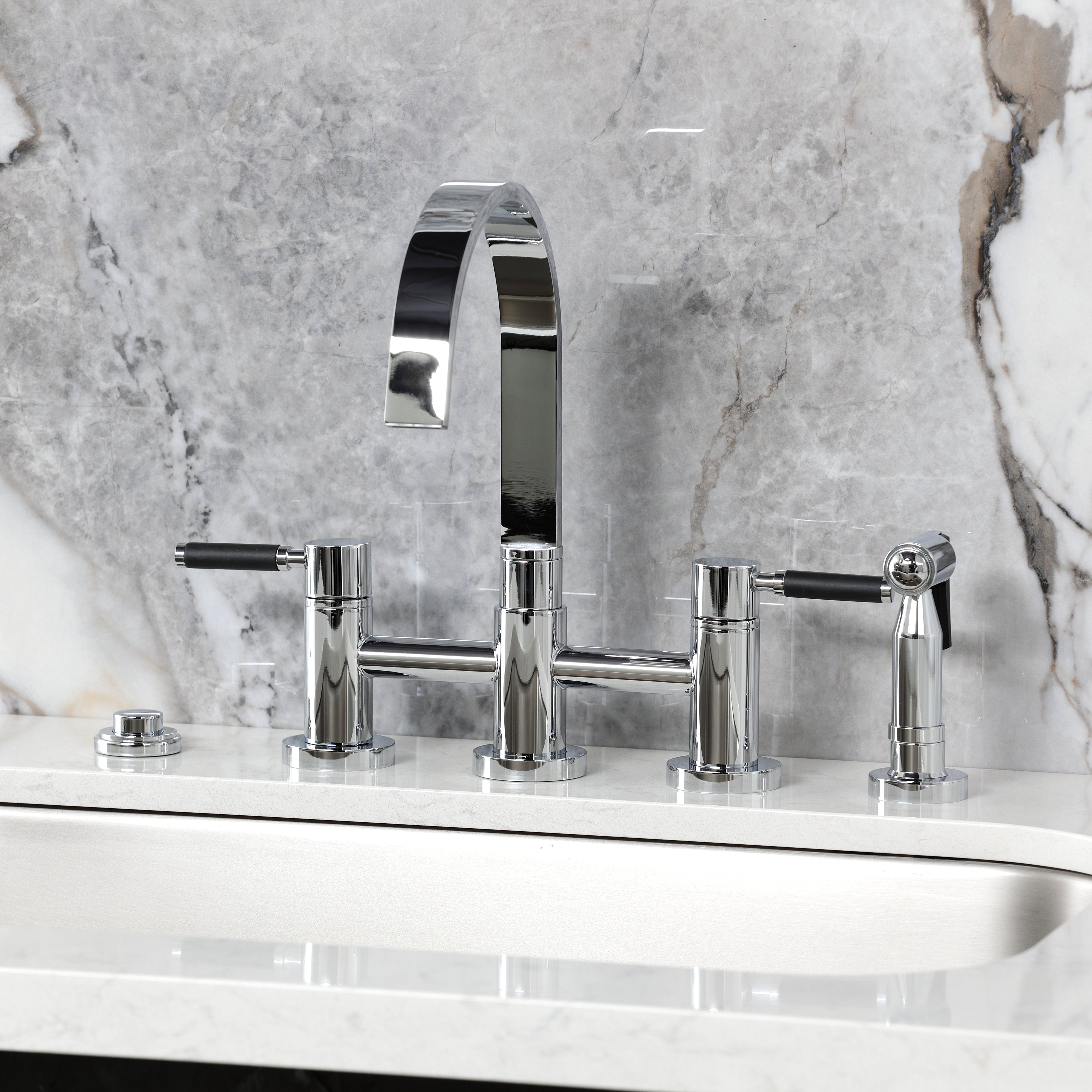 Kingston KS8267DKLBS Kaiser Bridge Kitchen Faucet with Brass Sprayer, Brushed Brass on a marble countertop.