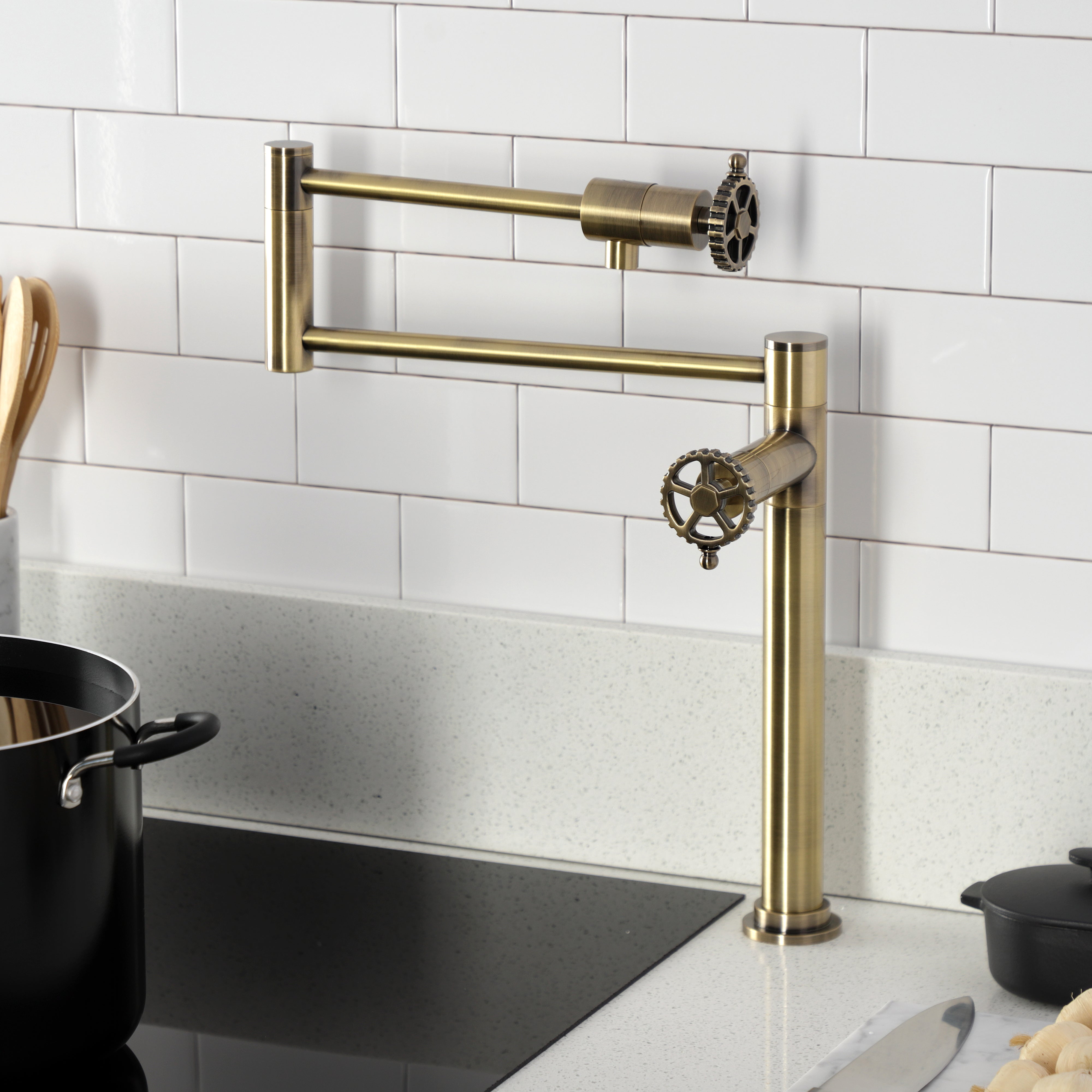 Kingston Brass KS4703CG Fuller Deck Mount Pot Filler Faucet, Antique Brass installed in a modern kitchen.