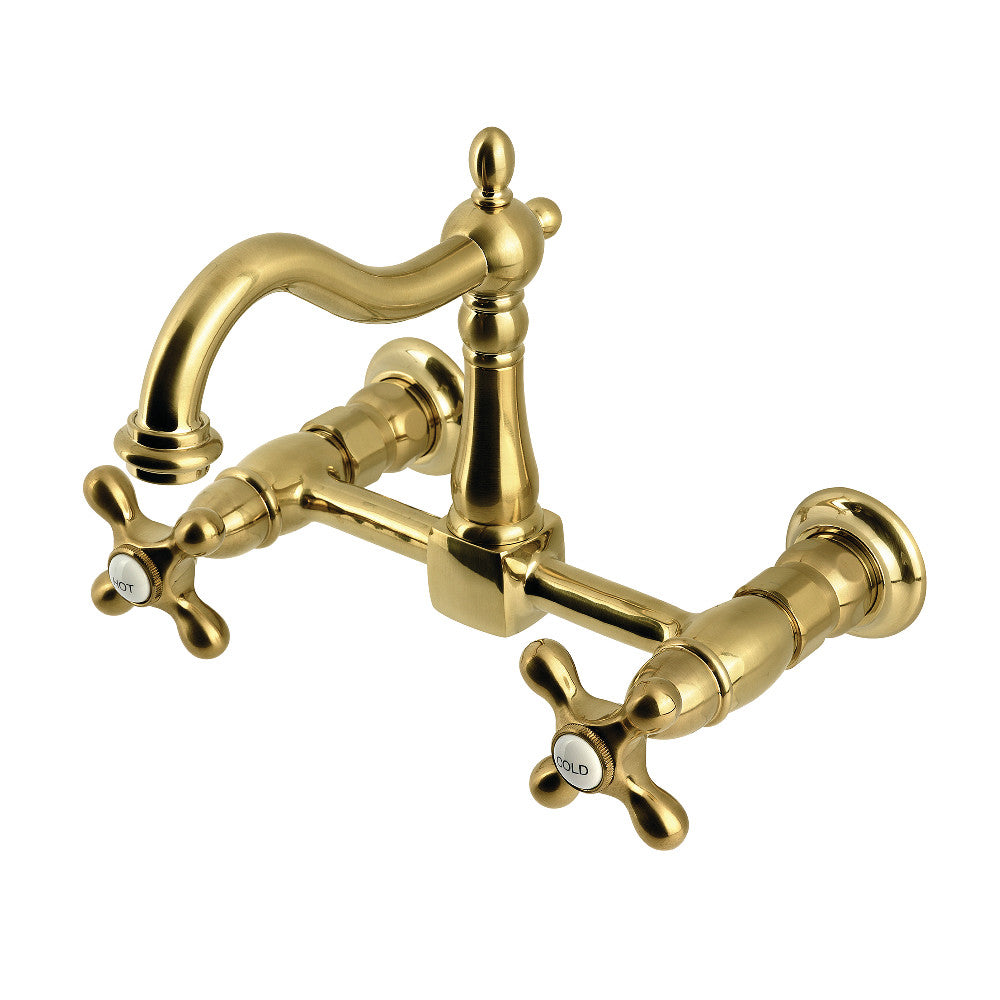Kingston KS1263AX Heritage Two-Handle Wall Mount Bridge Kitchen Faucet, Antique Brass with a brushed brass finish.