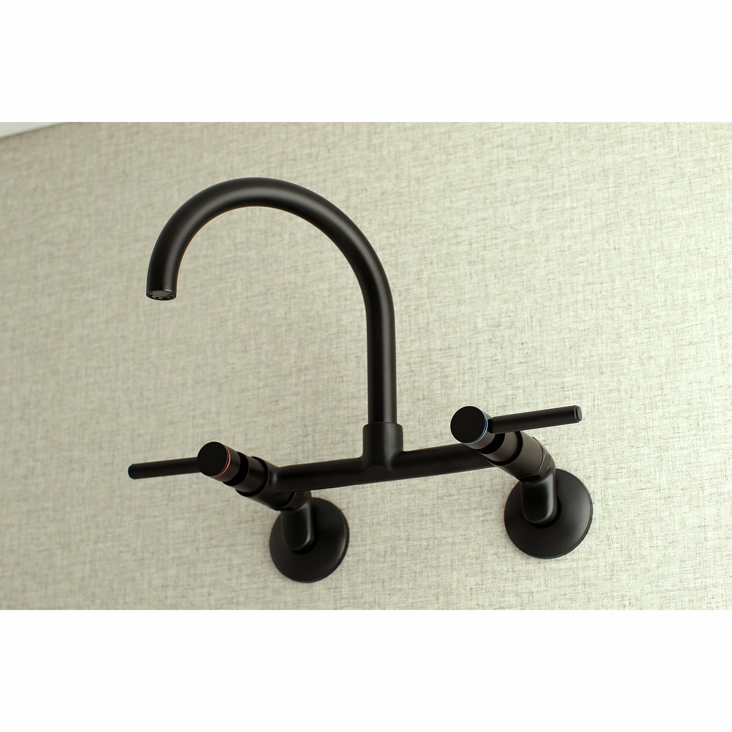 Kingston Brass KS814SB Concord Wall Mount Bridge Kitchen Faucet in elegant black finish on a textured wall.