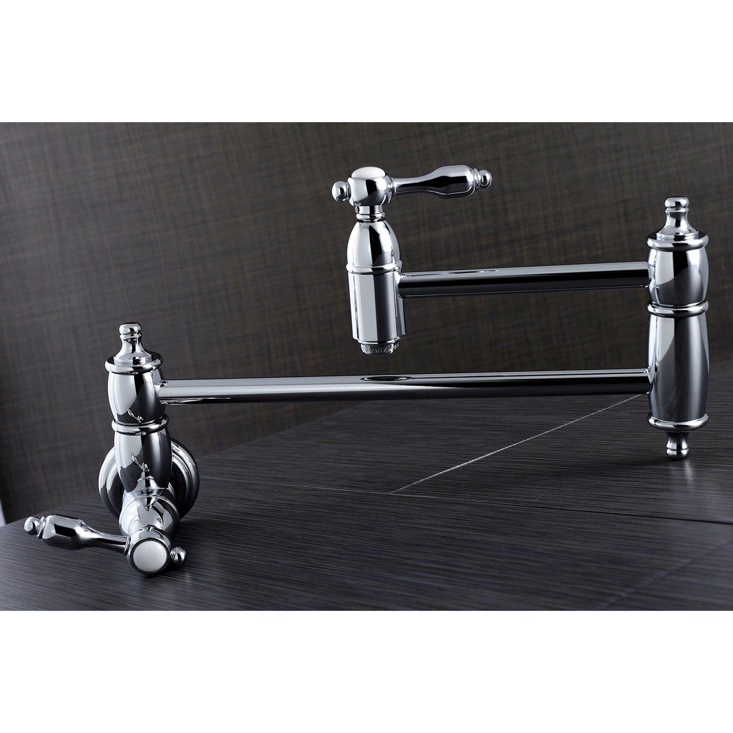 Kingston Brass KS3103TAL Tudor Wall Mount Pot Filler Faucet, Antique Brass in a chrome finish on a counter.