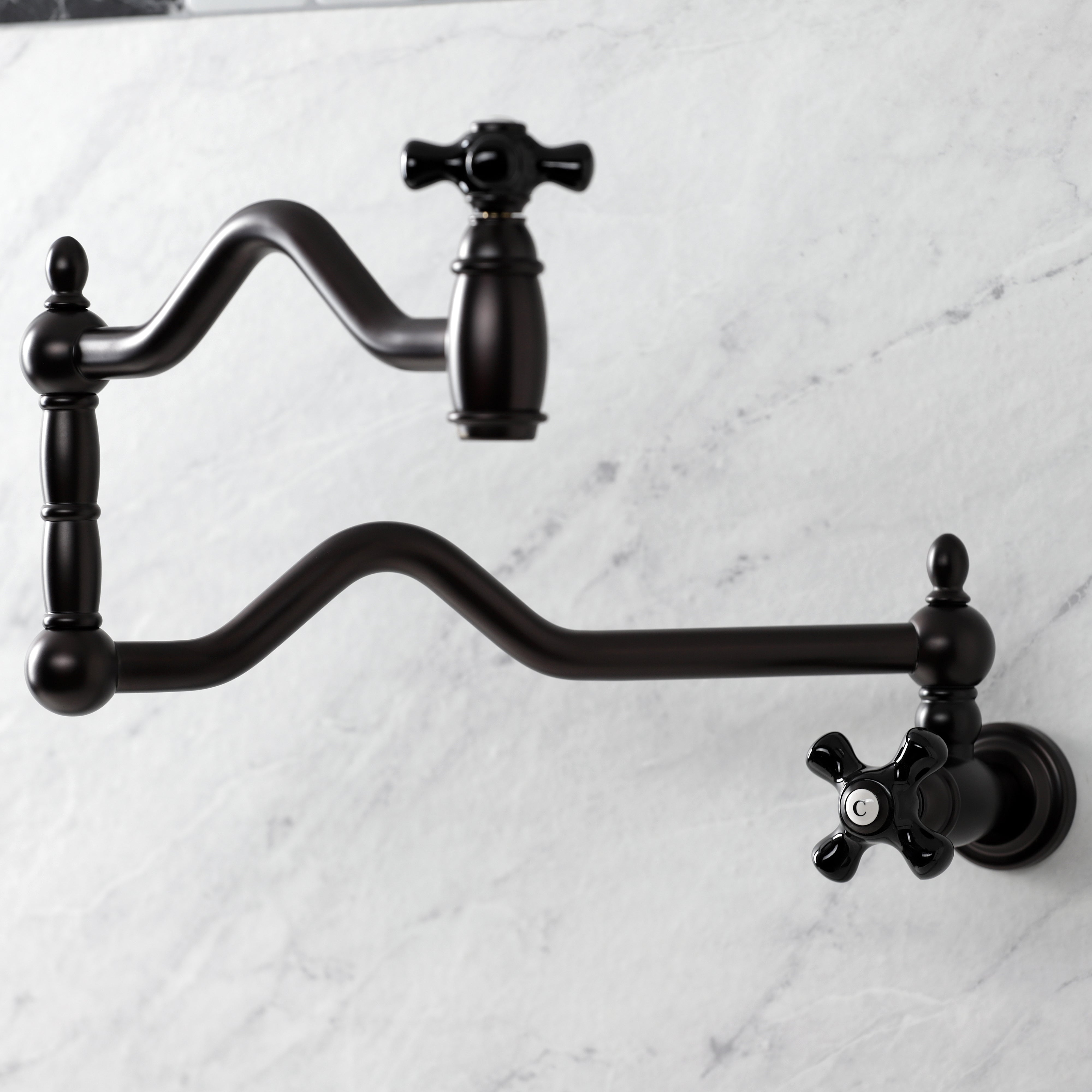 Kingston Brass KS2107PKX Duchess Wall Mount Pot Filler Faucet, Brushed Brass, featuring elegant black porcelain handles