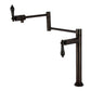 Kingston Brass KS4707PKL Duchess Deck Mount Pot Filler Faucet, Brushed Brass with black porcelain handles and oil rubbed bronze finish.