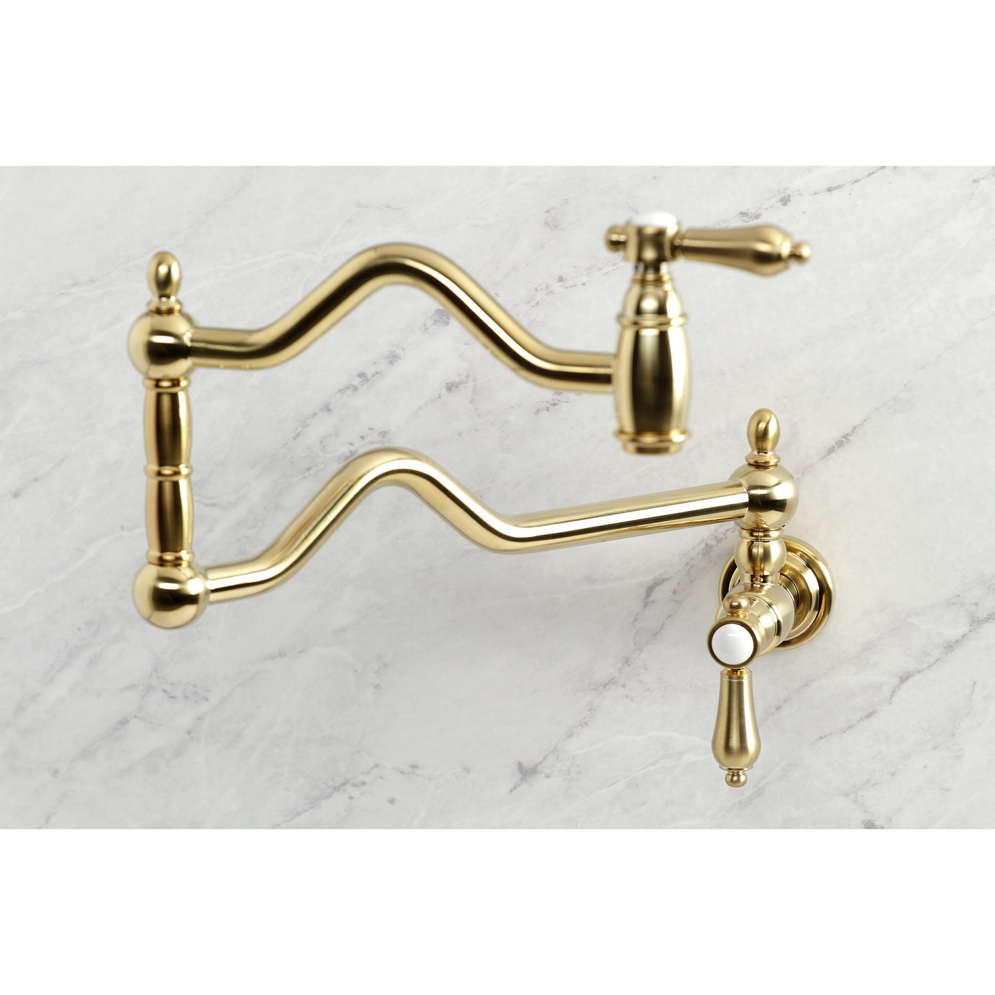 Kingston Brass KS2107BAL Heirloom Wall Mount Pot Filler Faucet, Brushed Brass on a marble background.