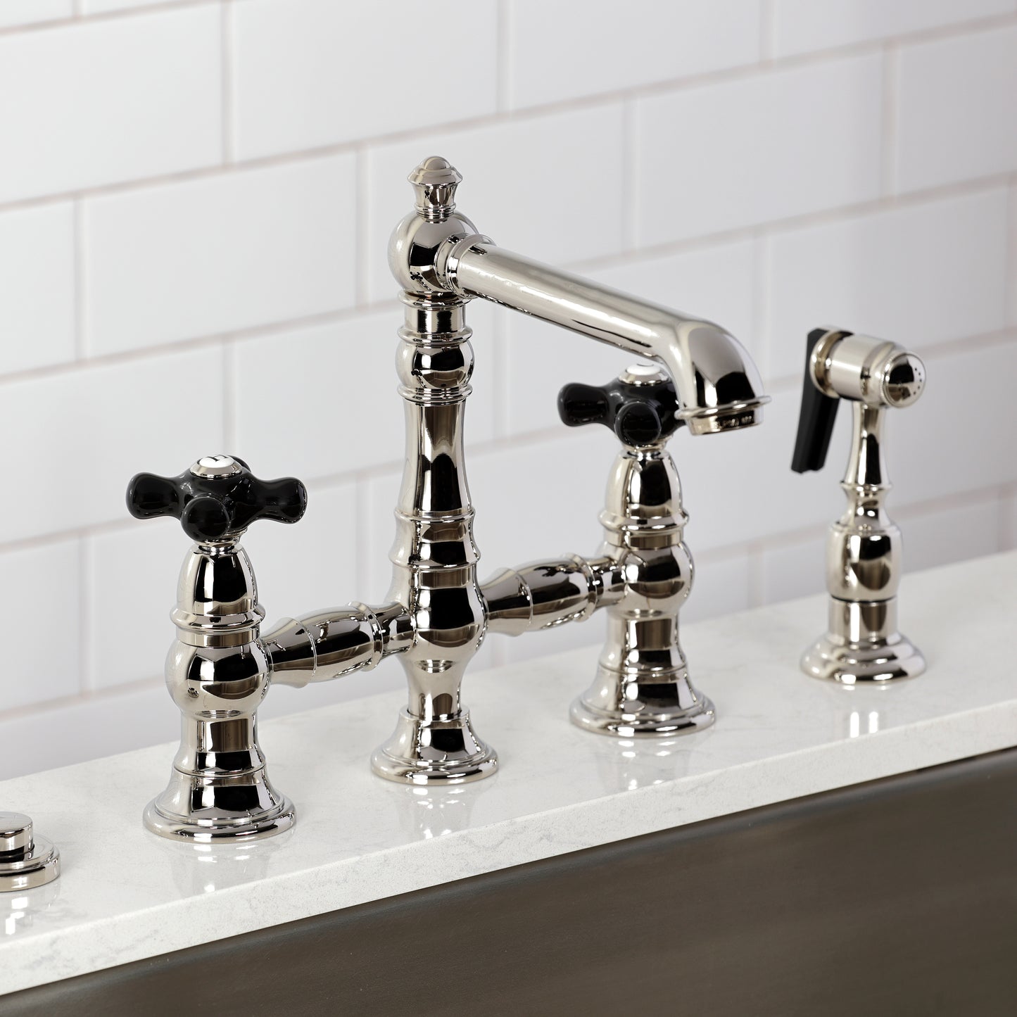 Kingston KS7277PKXBS Duchess Bridge Kitchen Faucet with Brass Sprayer, Brushed Brass close-up view