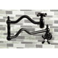 Kingston Brass KS2107AX Heritage Wall Mount Pot Filler Faucet, Brushed Brass installed above a kitchen stove.