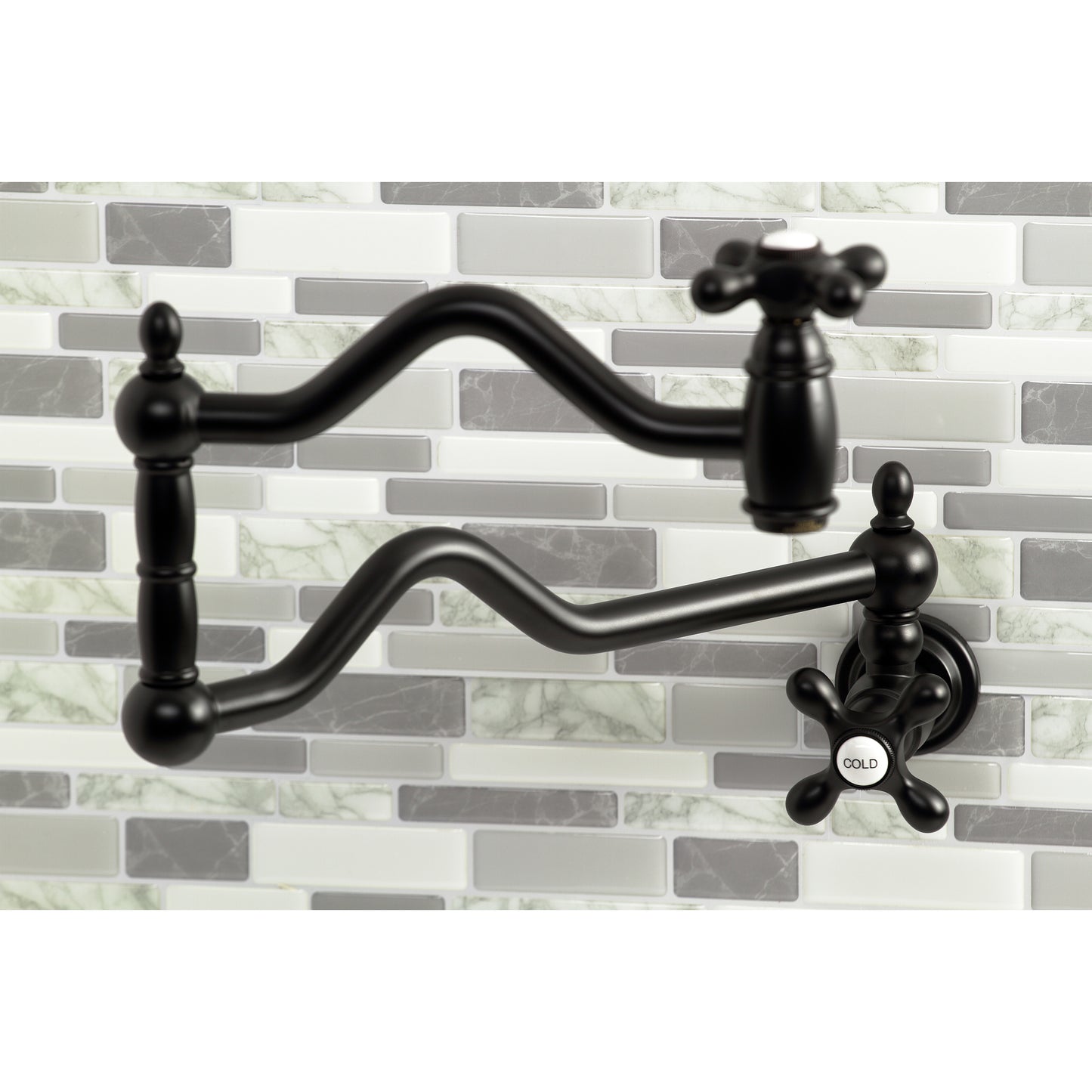 Kingston Brass KS2107AX Heritage Wall Mount Pot Filler Faucet, Brushed Brass installed above a kitchen stove.