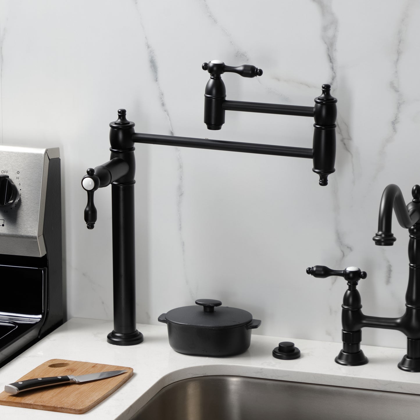 Kingston Brass KS3708TAL Tudor Deck Mount Pot Filler Faucet, Brushed Nickel on the kitchen countertop.