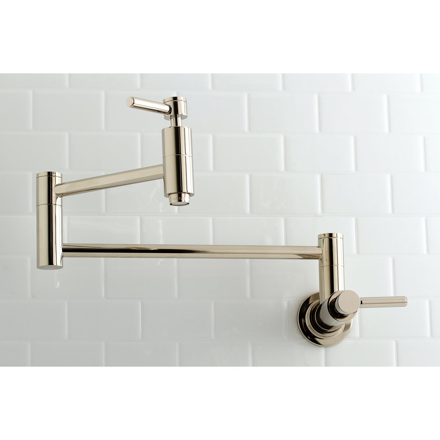 Kingston Brass KS8103DL Concord Wall Mount Pot Filler Faucet, Antique Brass displayed on white subway tile