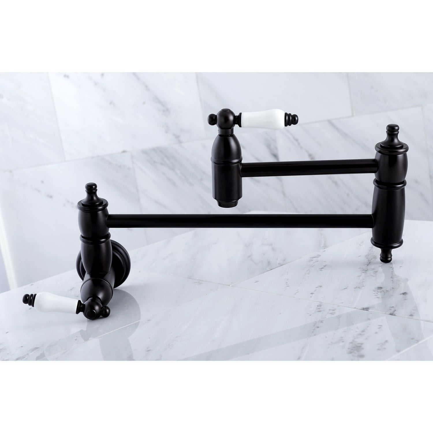 Kingston Brass KS3103PL Restoration Wall Mount Pot Filler Faucet, Antique Brass on a marble surface.