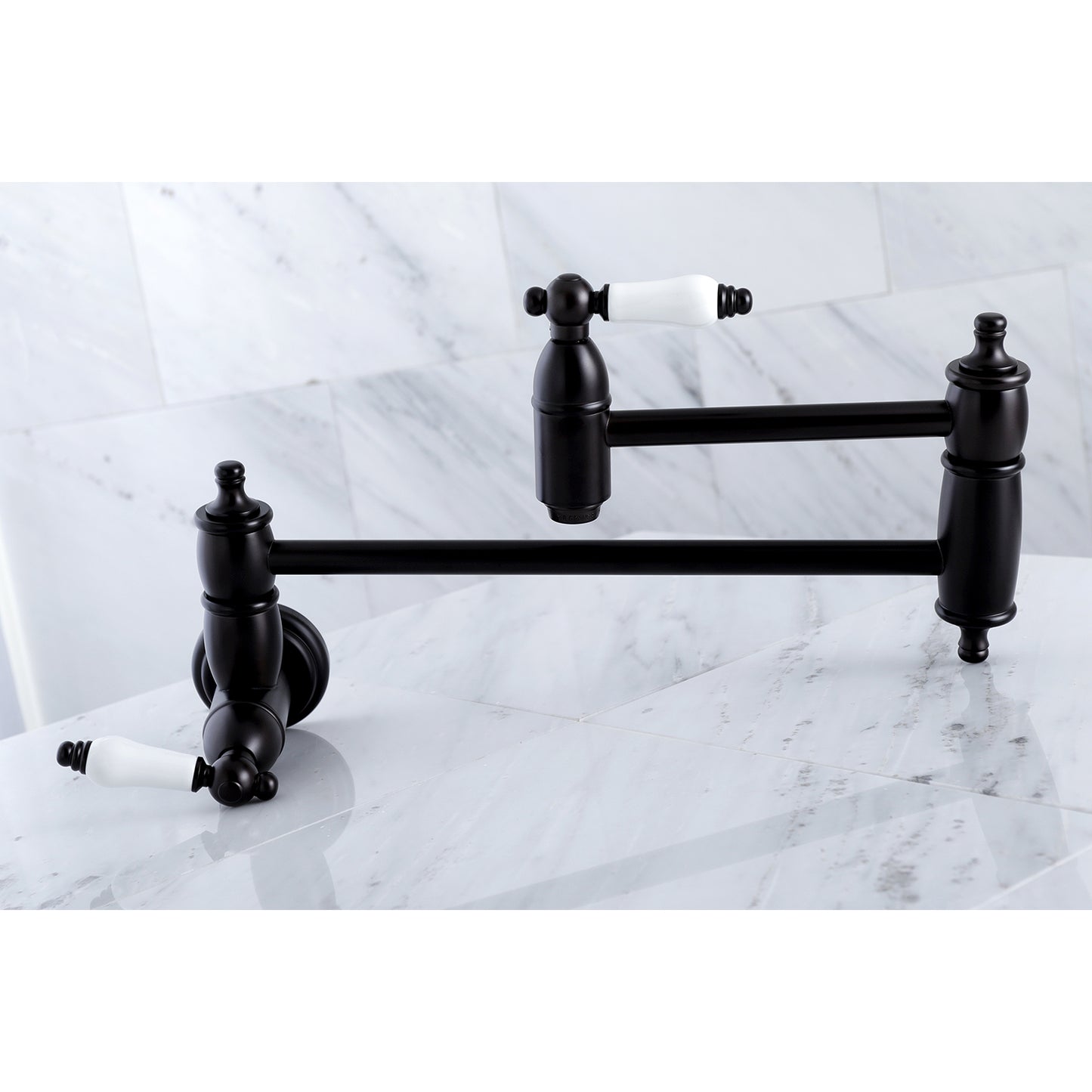 Kingston Brass KS3103PL Restoration Wall Mount Pot Filler Faucet, Antique Brass on a marble surface.