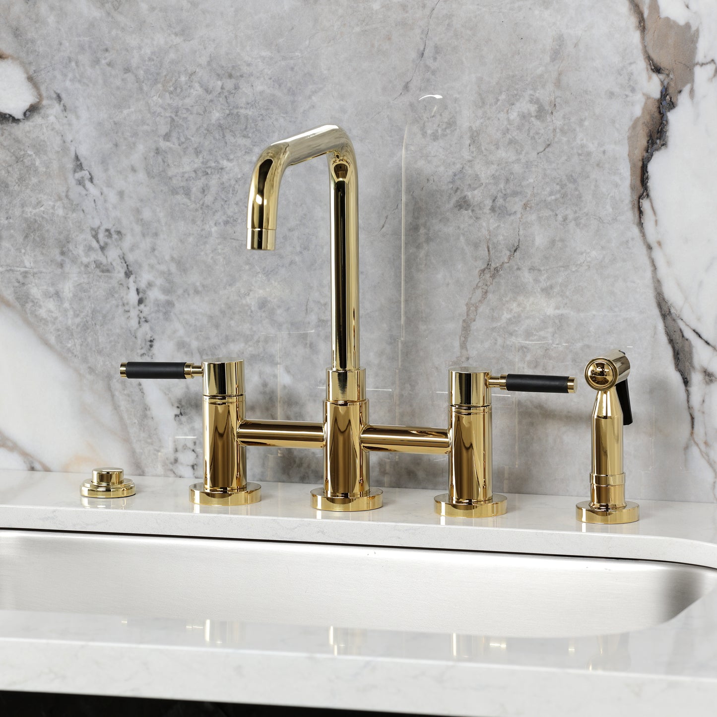Kingston KS8287DKLBS Kaiser Bridge Kitchen Faucet with Brass Sprayer, Brushed Brass on a modern kitchen countertop.