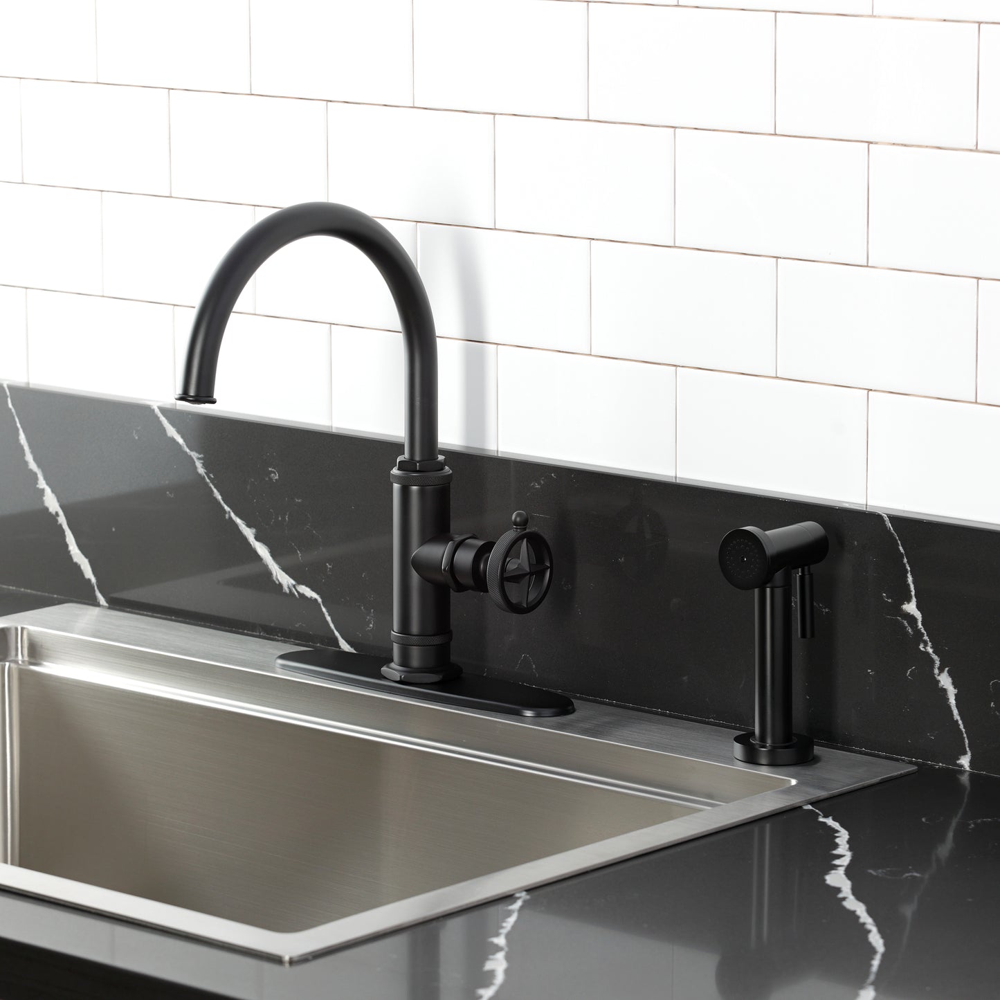 Kingston Brass KSD2433RNK Levante Single-Handle Kitchen Faucet, Antique Brass on black countertop with side spray.