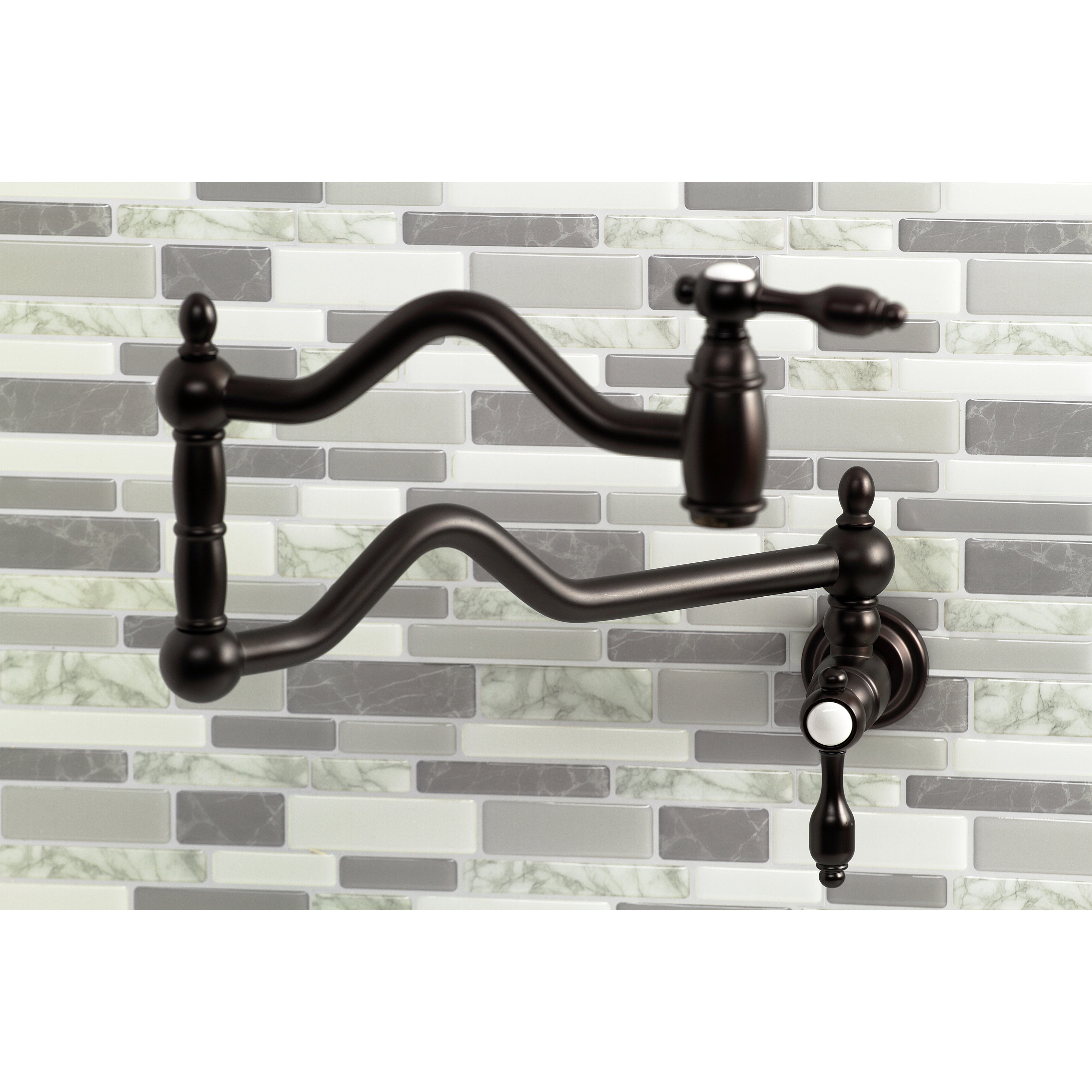 Kingston Brass KS2107TAL Tudor Wall Mount Pot Filler Faucet, Brushed Brass close-up on wall with mosaic tiles.