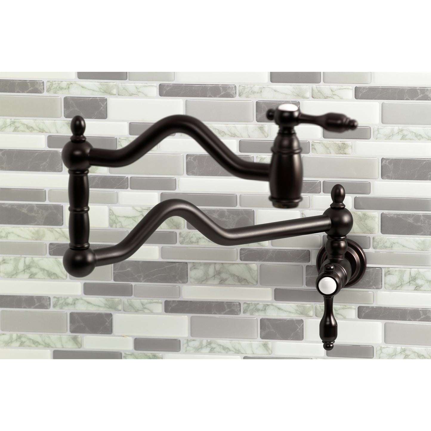 Kingston Brass KS2107TAL Tudor Wall Mount Pot Filler Faucet, Brushed Brass close-up on wall with mosaic tiles.