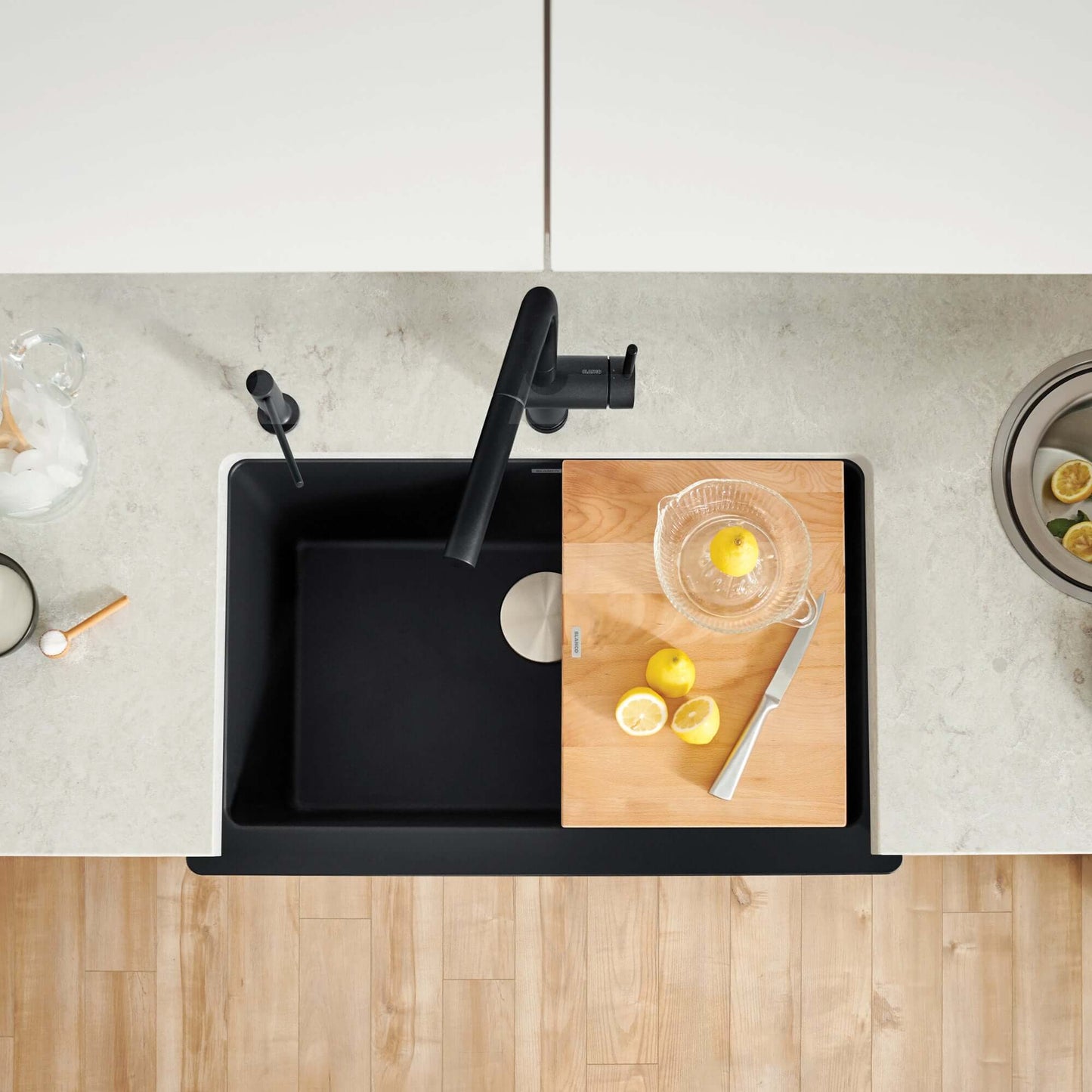 BLANCO VINTERA 30" SILGRANIT Single Bowl Farmhouse Sink with cutting board and lemons on countertop.