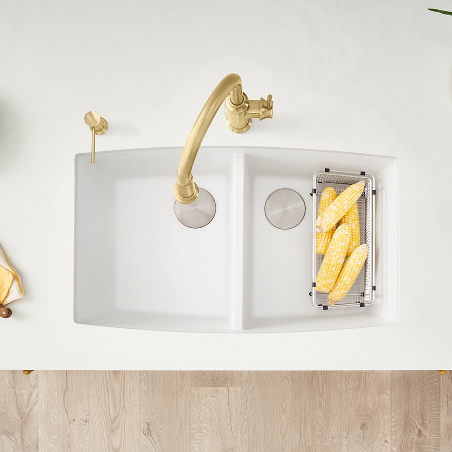 BLANCO Performa SILGRANIT 33" 50/50 Double Bowl Undermount Kitchen Sink with corn in basket and stylish faucet.