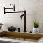 Kingston Brass KS8708DFL NuWave Deck Mount Pot Filler Faucet, Brushed Nickel in a modern kitchen setting.