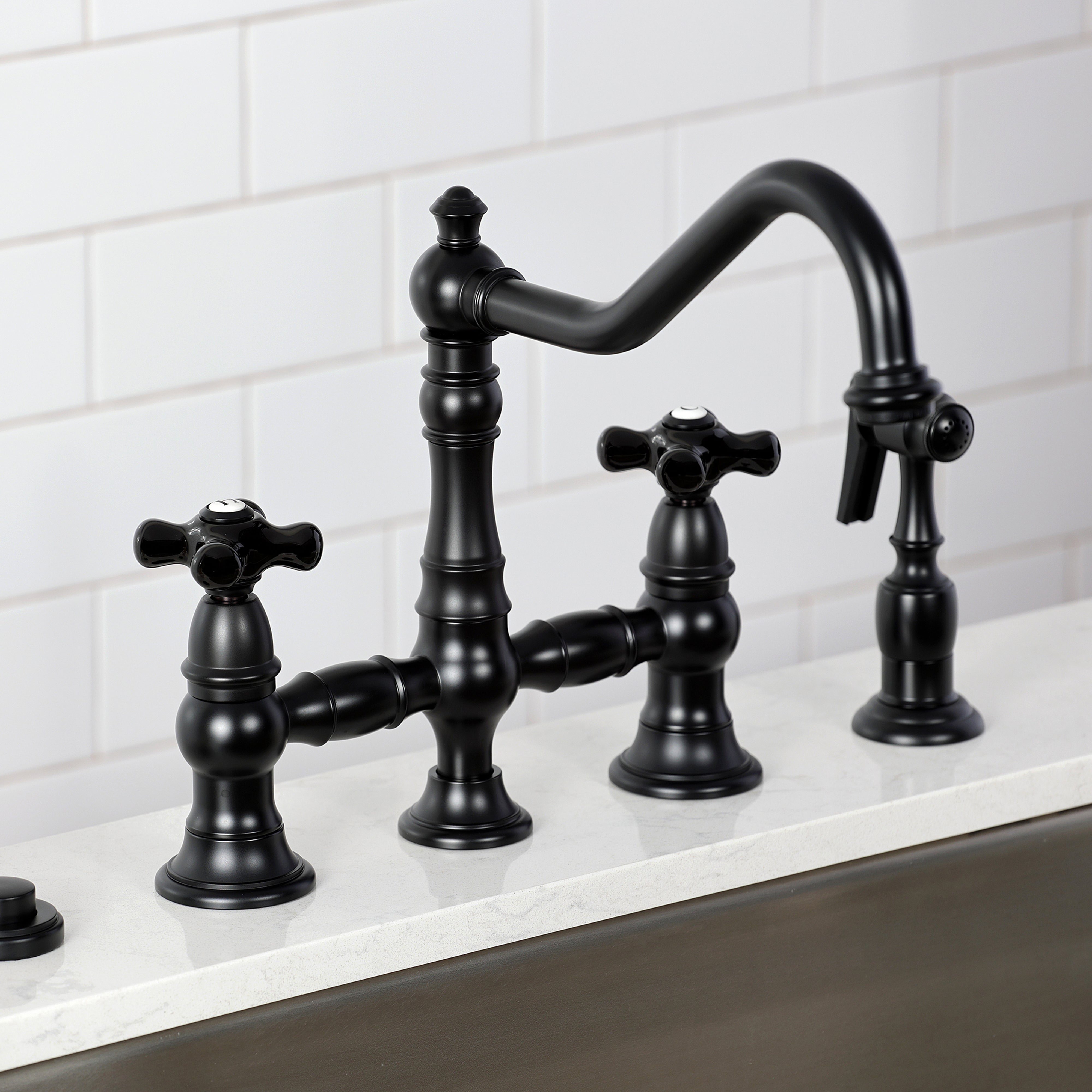 Kingston KS3277PKXBS Duchess Bridge Kitchen Faucet with Brass Sprayer, Brushed Brass in a kitchen setting.