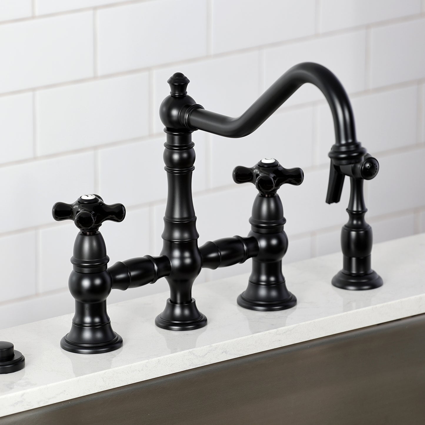 Kingston KS3277PKXBS Duchess Bridge Kitchen Faucet with Brass Sprayer, Brushed Brass in a kitchen setting.