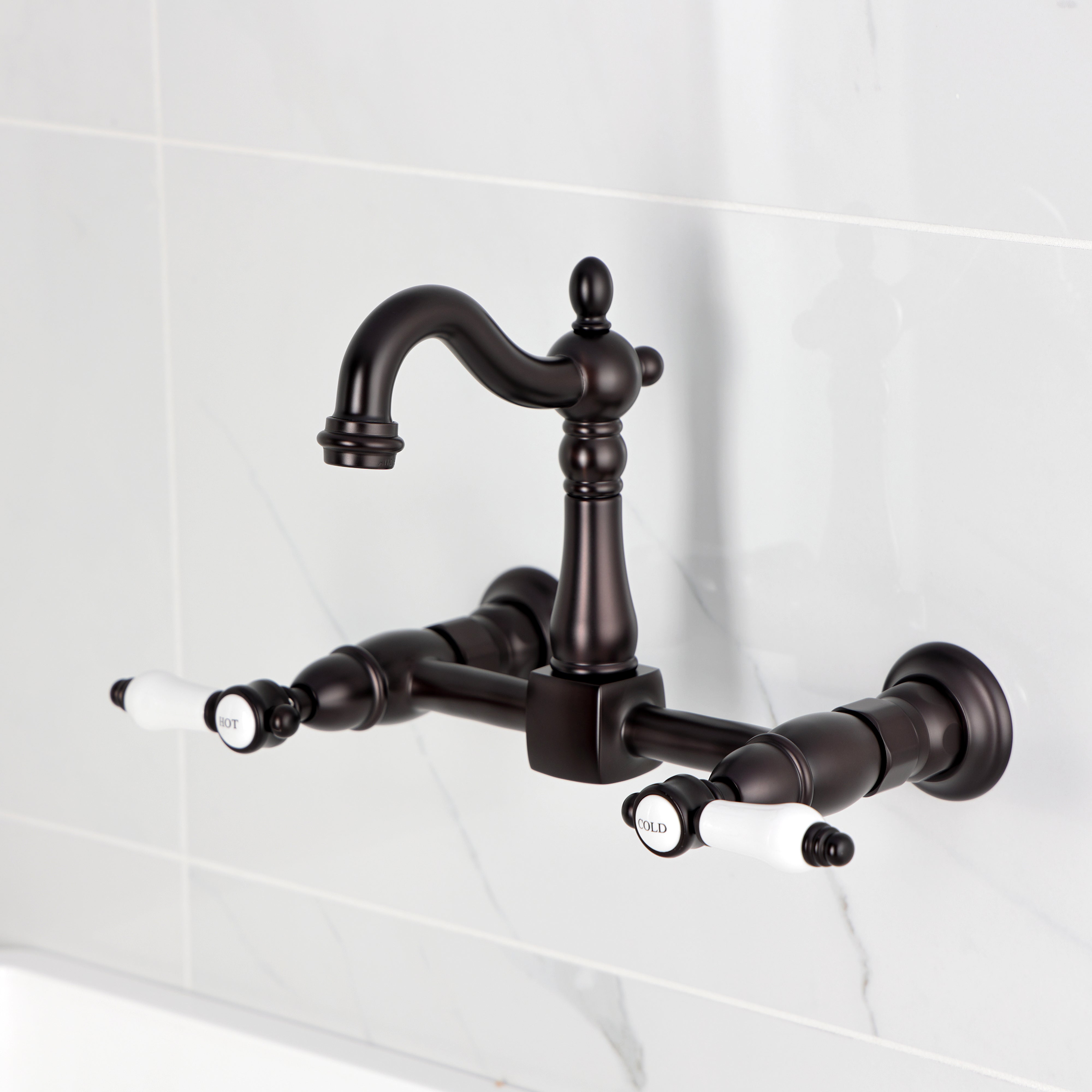 Kingston KS2443BPL Bel-Air Two-Handle Wall Mount Bridge Kitchen Faucet, Antique Brass in a traditional design.