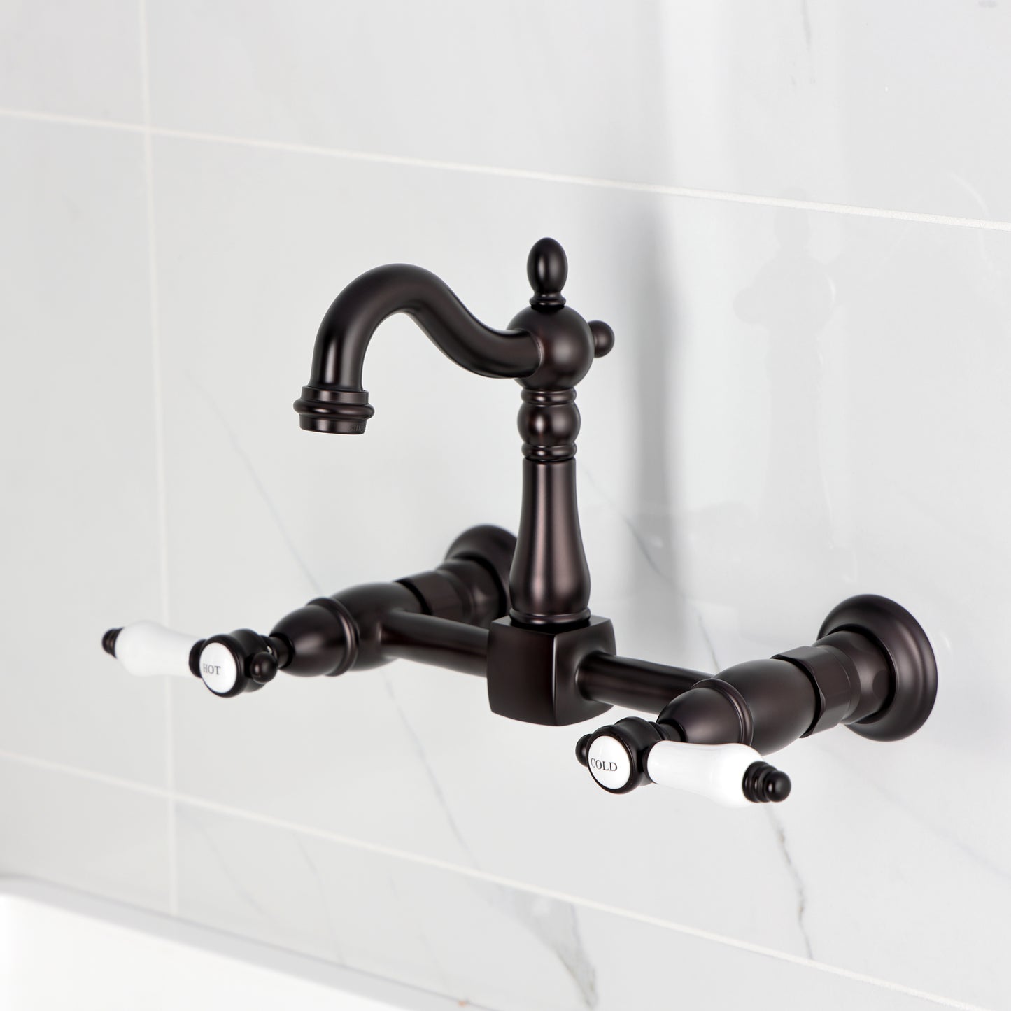 Kingston KS2443BPL Bel-Air Two-Handle Wall Mount Bridge Kitchen Faucet, Antique Brass in a traditional design.