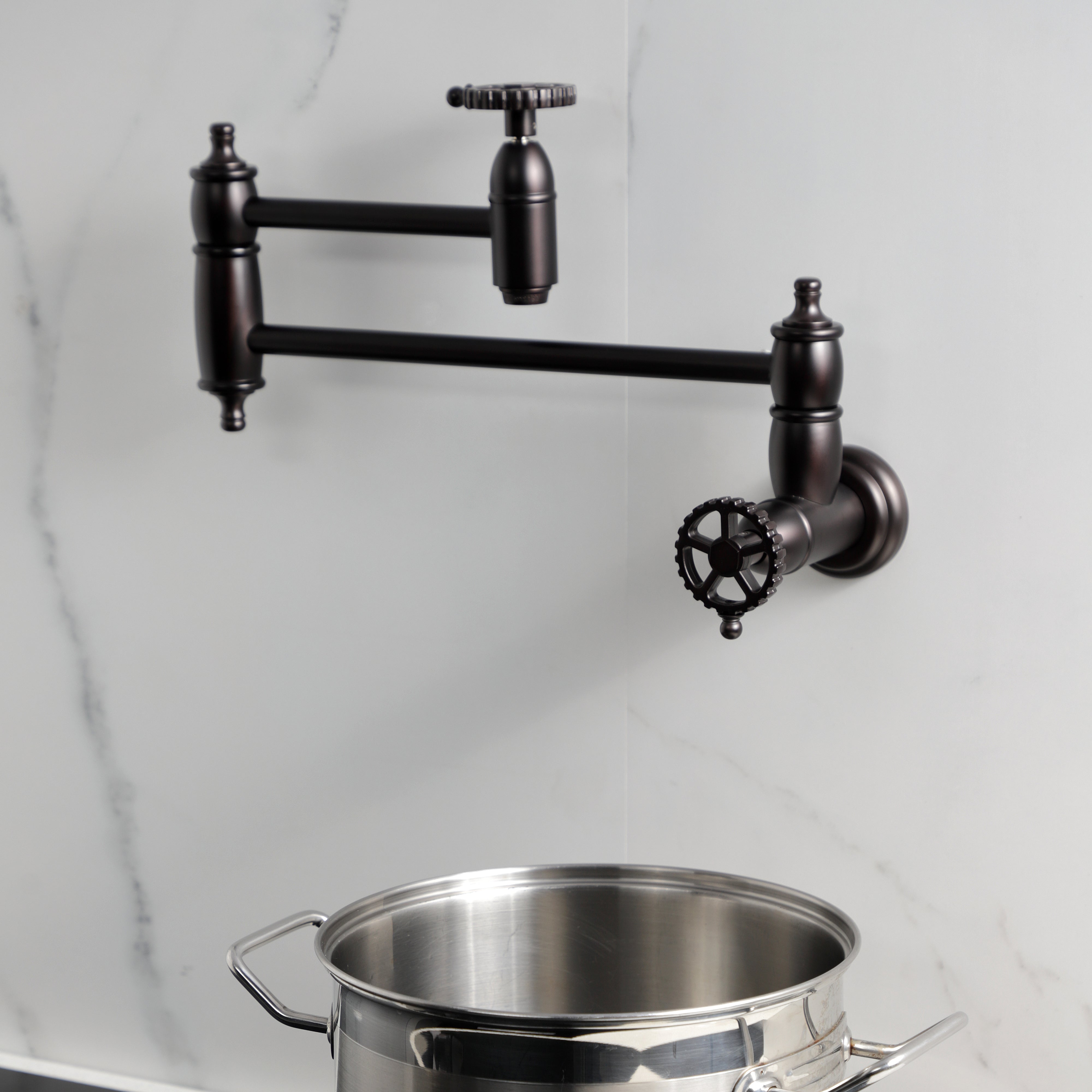 Kingston Brass KS3103CG Fuller Wall Mount Pot Filler Faucet, Antique Brass mounted with pot below