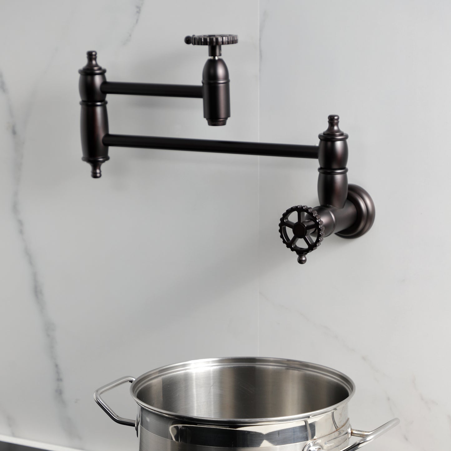 Kingston Brass KS3103CG Fuller Wall Mount Pot Filler Faucet, Antique Brass mounted with pot below