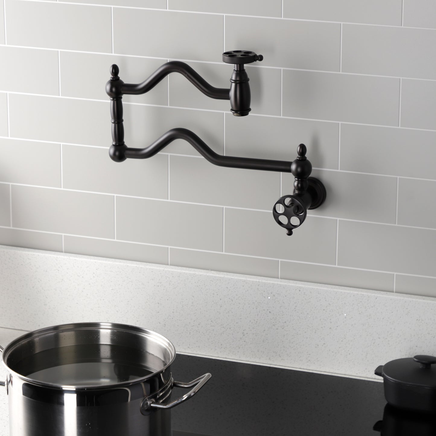 Kingston Brass KS2107RKZ Wendell Wall Mount Pot Filler Faucet with Knurled Handle, Brushed Brass in kitchen